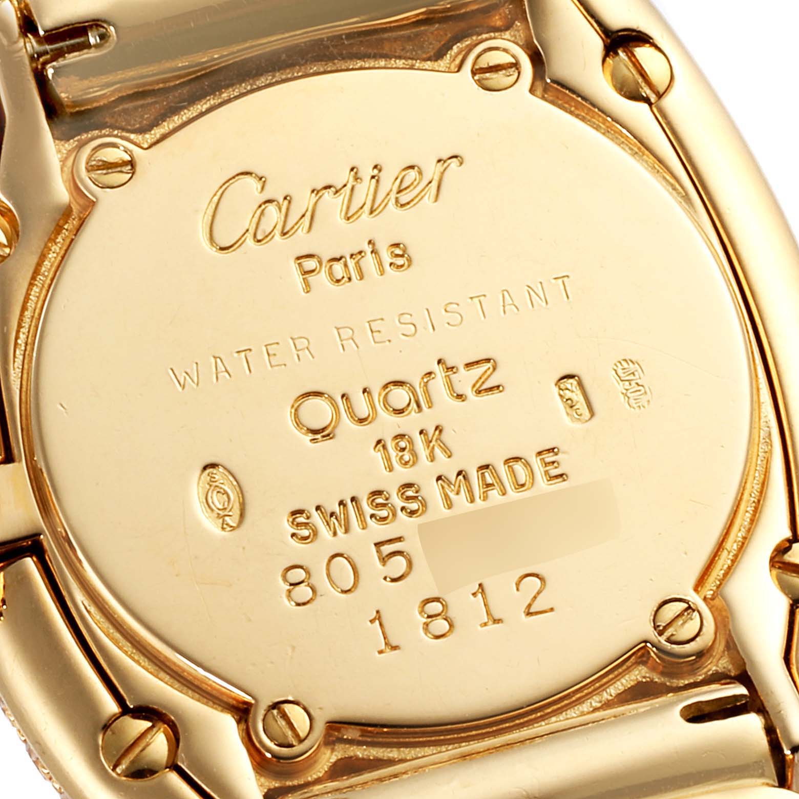 The image shows the back case of a Cartier Baignoire 1812 Women's Yellow Gold Silver Dial 1812 Women's Yellow Gold Silver Dial model watch, highlighting its brand, model details, and specifications.