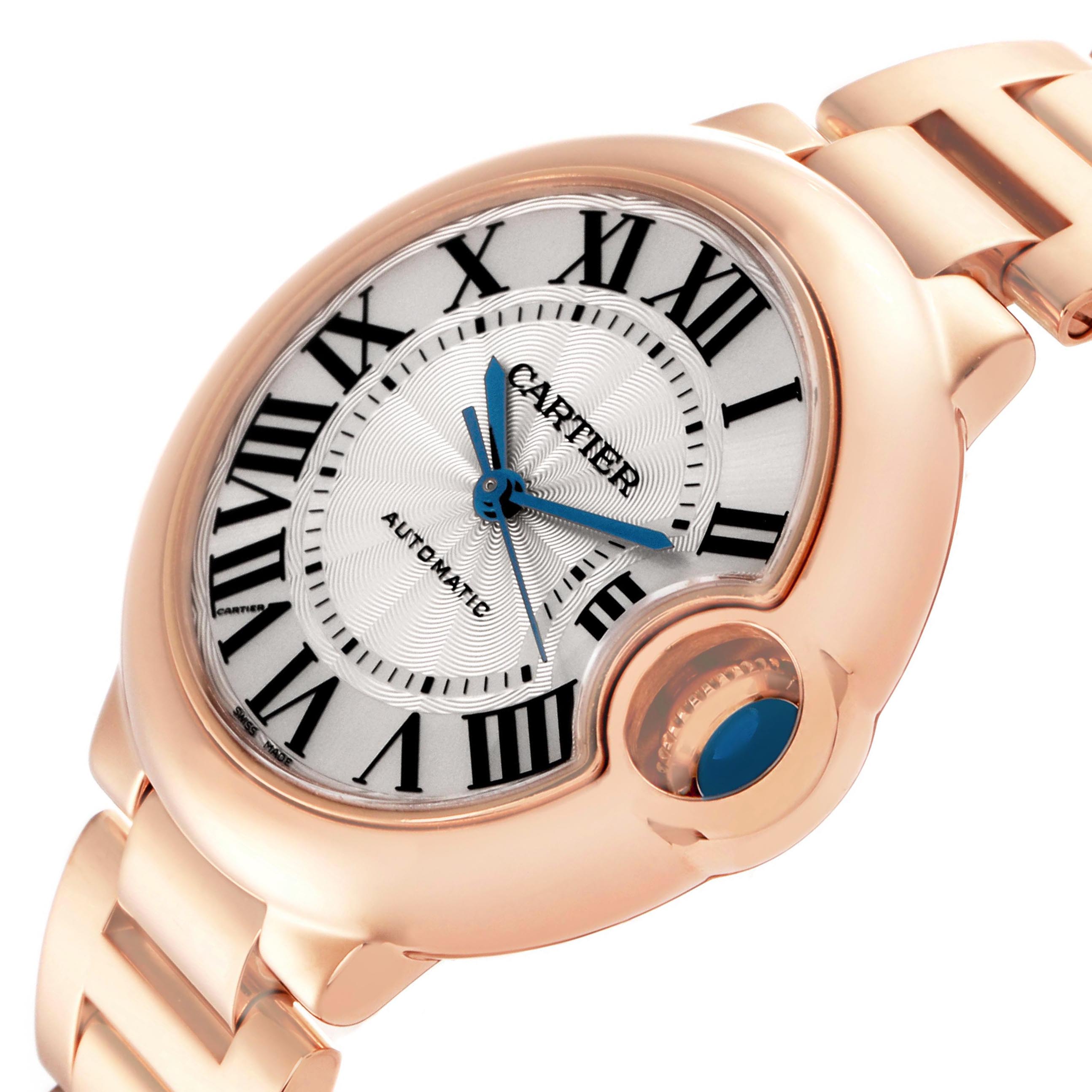 The Cartier Ballon Bleu W6920096 Women's Rose Gold Silver Dial watch is shown at an angle highlighting its face, crown, and partial bracelet.