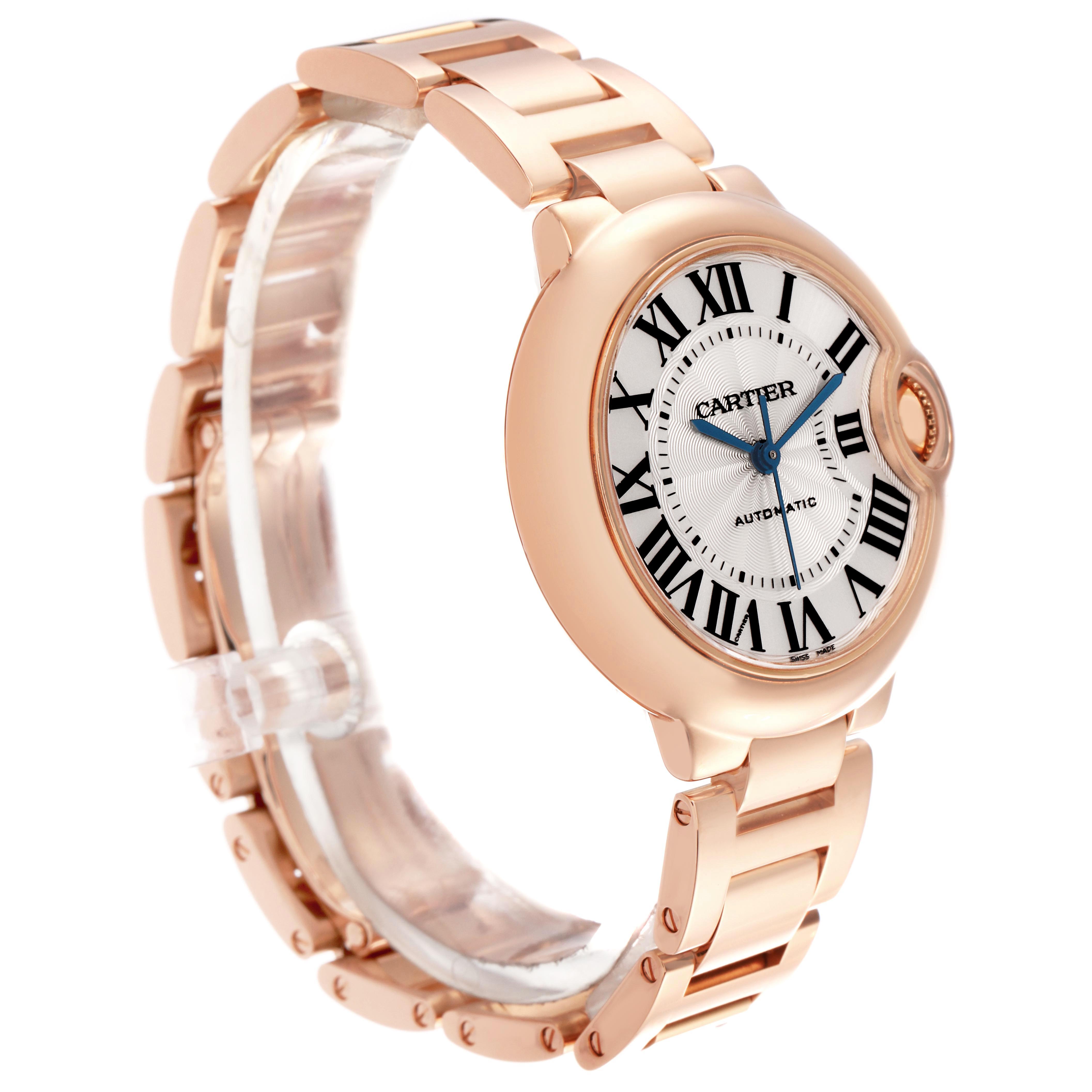 The Cartier Ballon Bleu W6920096 Women's Rose Gold Silver Dial watch is shown at a three-quarter angle, displaying its dial, crown, and bracelet.
