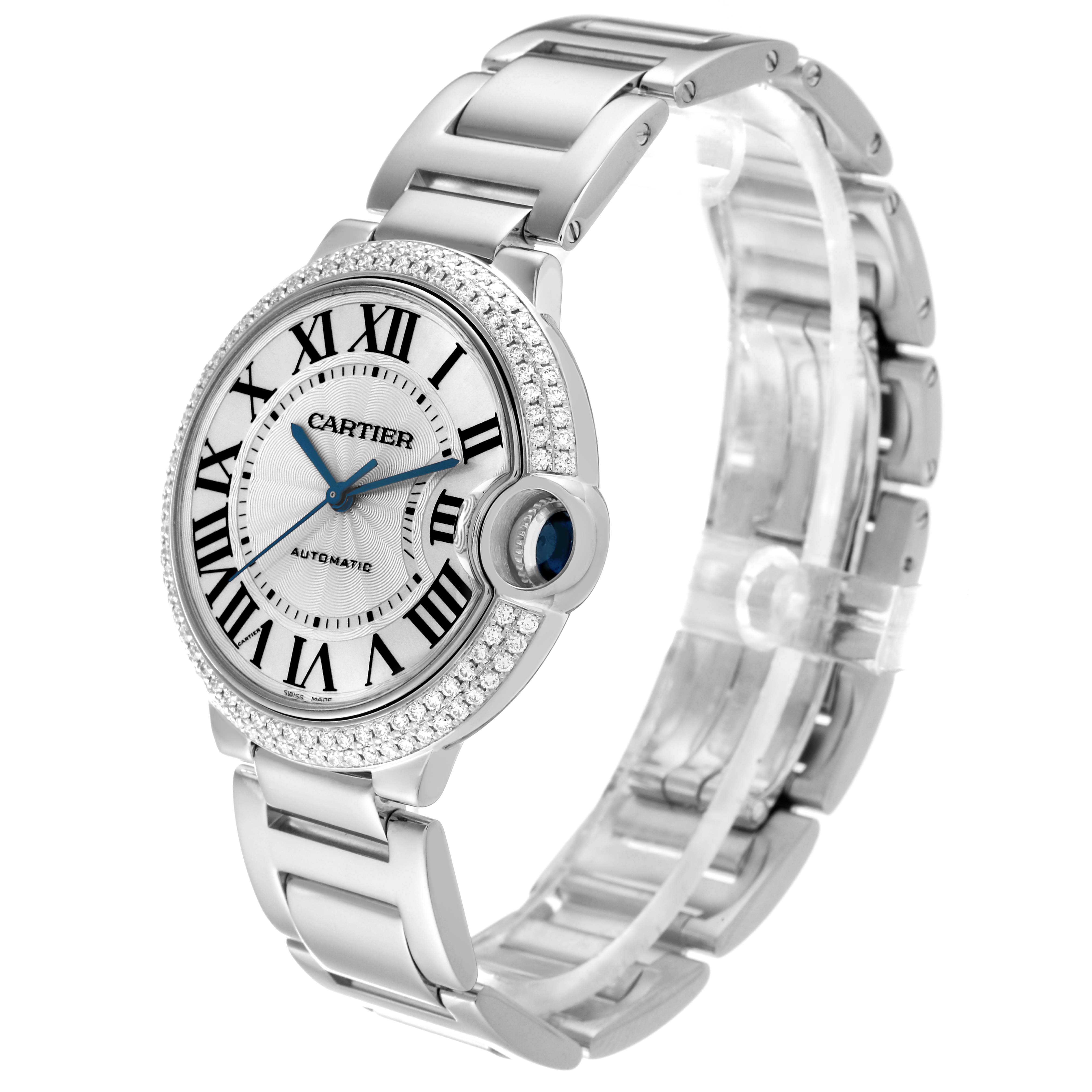 The image shows a Cartier Ballon Bleu WE9006Z3 Men's White Gold Silver Dial WE9006Z3 Men's White Gold Silver Dial watch at a slight angle, highlighting its face, bracelet, and diamond-studded bezel.