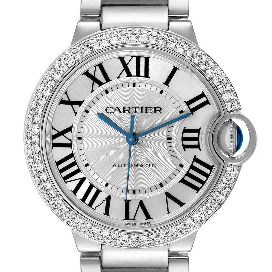 The image shows a close-up of a Cartier Ballon Bleu watch face, highlighting its Roman numerals, blue hands, and diamond-encrusted bezel.