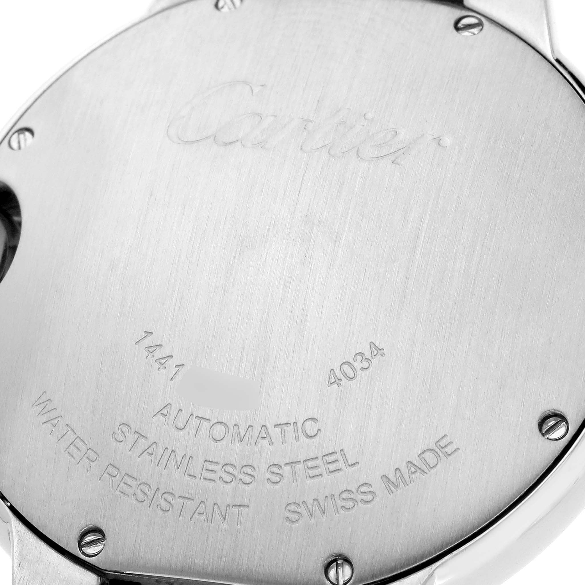 The image shows the back case of a Ballon Bleu watch by Cartier, highlighting the engravings and screws.