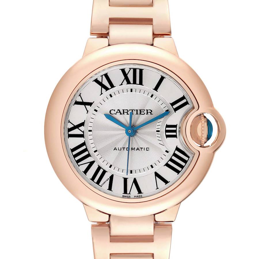 The Cartier Ballon Bleu watch is shown from the front, highlighting its round face, Roman numerals, blue hands, and crown.