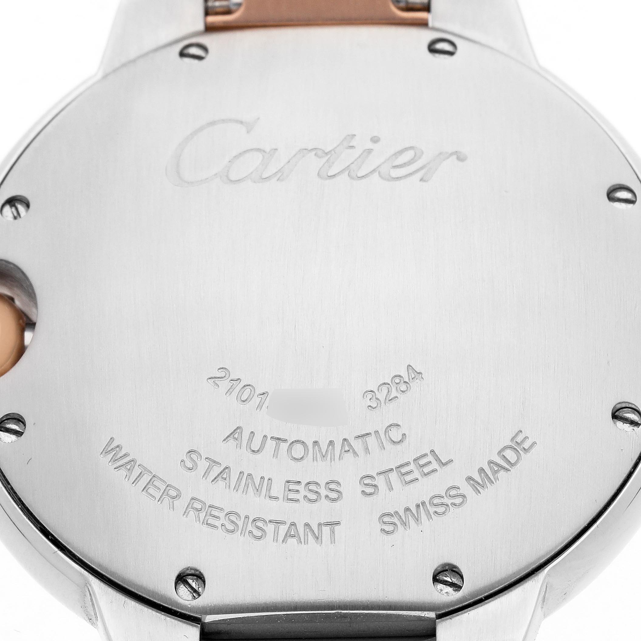 The image shows the back of the Cartier Ballon Bleu W6920033 Women's Steel and Gold (two tone) Mother of Pearl Dial W6920033 Women's Steel and Gold (two tone) Mother of Pearl Dial watch, highlighting its engraving details and material information.