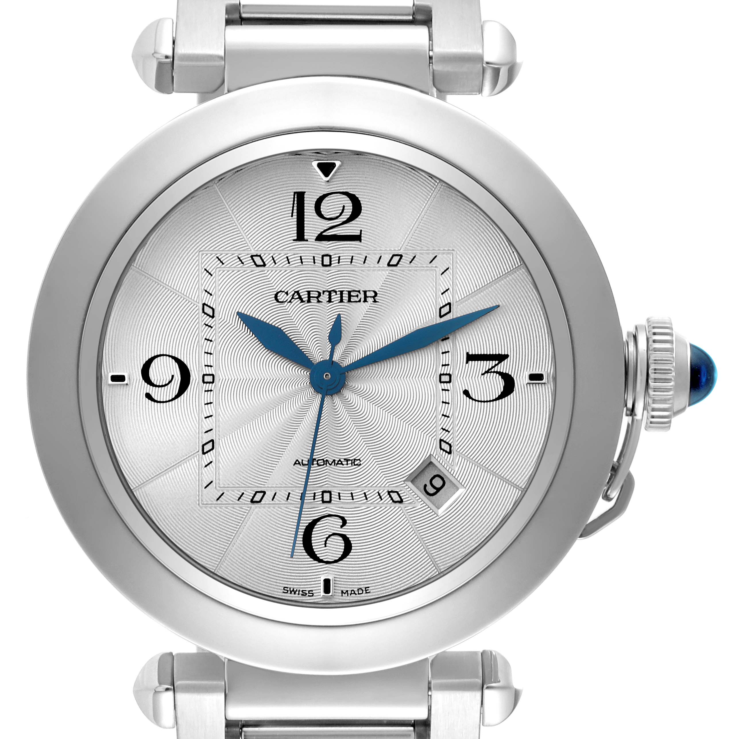 The Cartier Pasha WSPA0009 Men's Stainless Steel Silver Dial WSPA0009 Men's Stainless Steel Silver Dial watch is shown from the front, displaying the dial, hour markers, blue hands, and the crown with a blue gem.