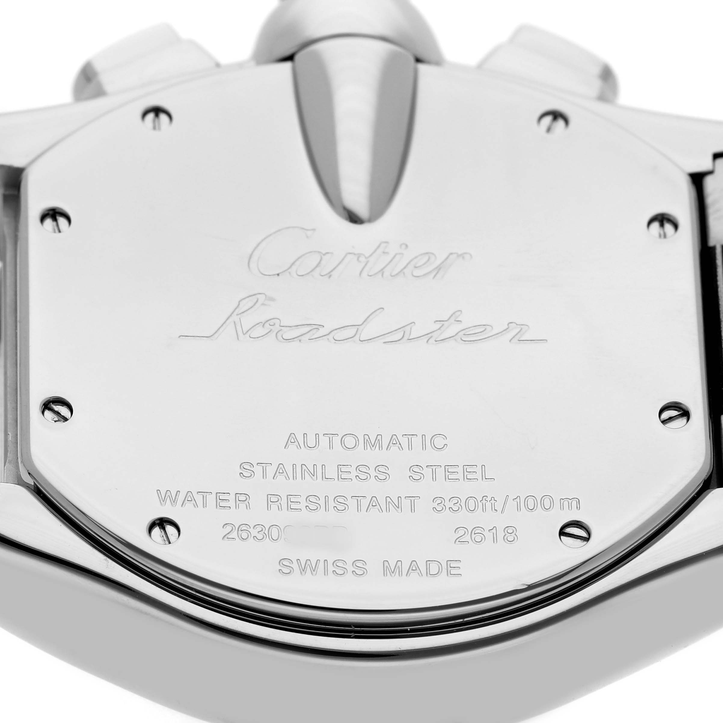 The image shows the back casing of the Cartier Roadster W62020X6 Men's Stainless Steel Black Dial watch with engraving details.