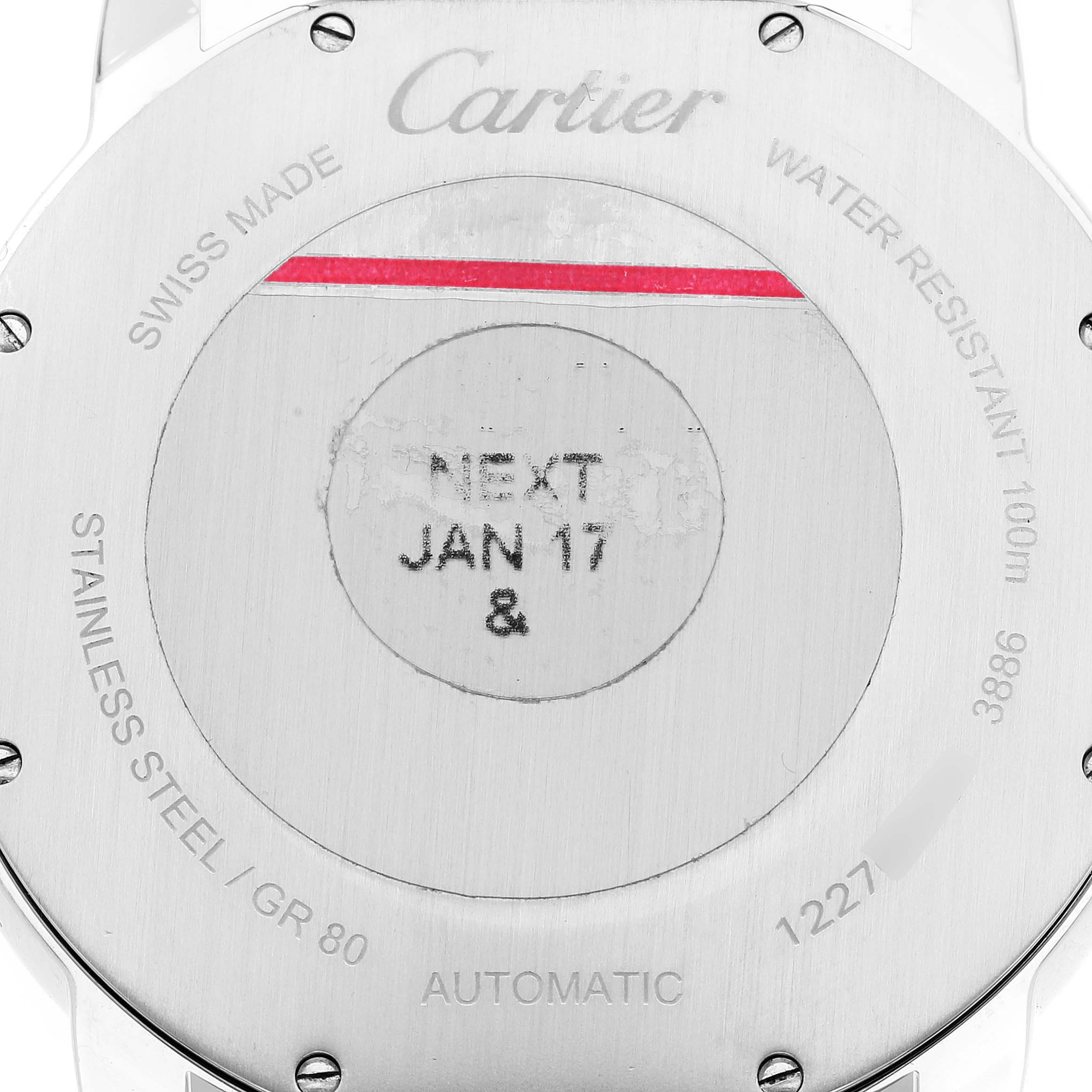 This image shows the case back of a Cartier Ronde W2RN0005 Men's Steel and Gold (two tone) Grey Dial W2RN0005 Men's Steel and Gold (two tone) Grey Dial model watch, displaying inscriptions such as "SWISS MADE" and "WATER RESISTANT 100m."