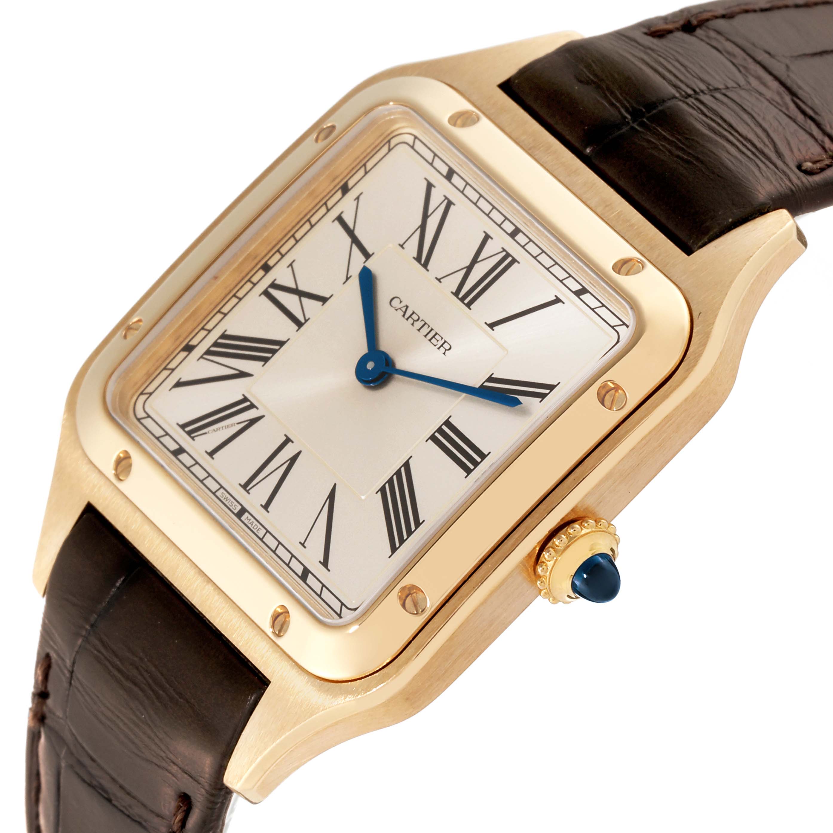 This image shows a close-up, angled view of the Santos Dumont watch by Cartier, highlighting its face, bezel, crown, and part of the strap.