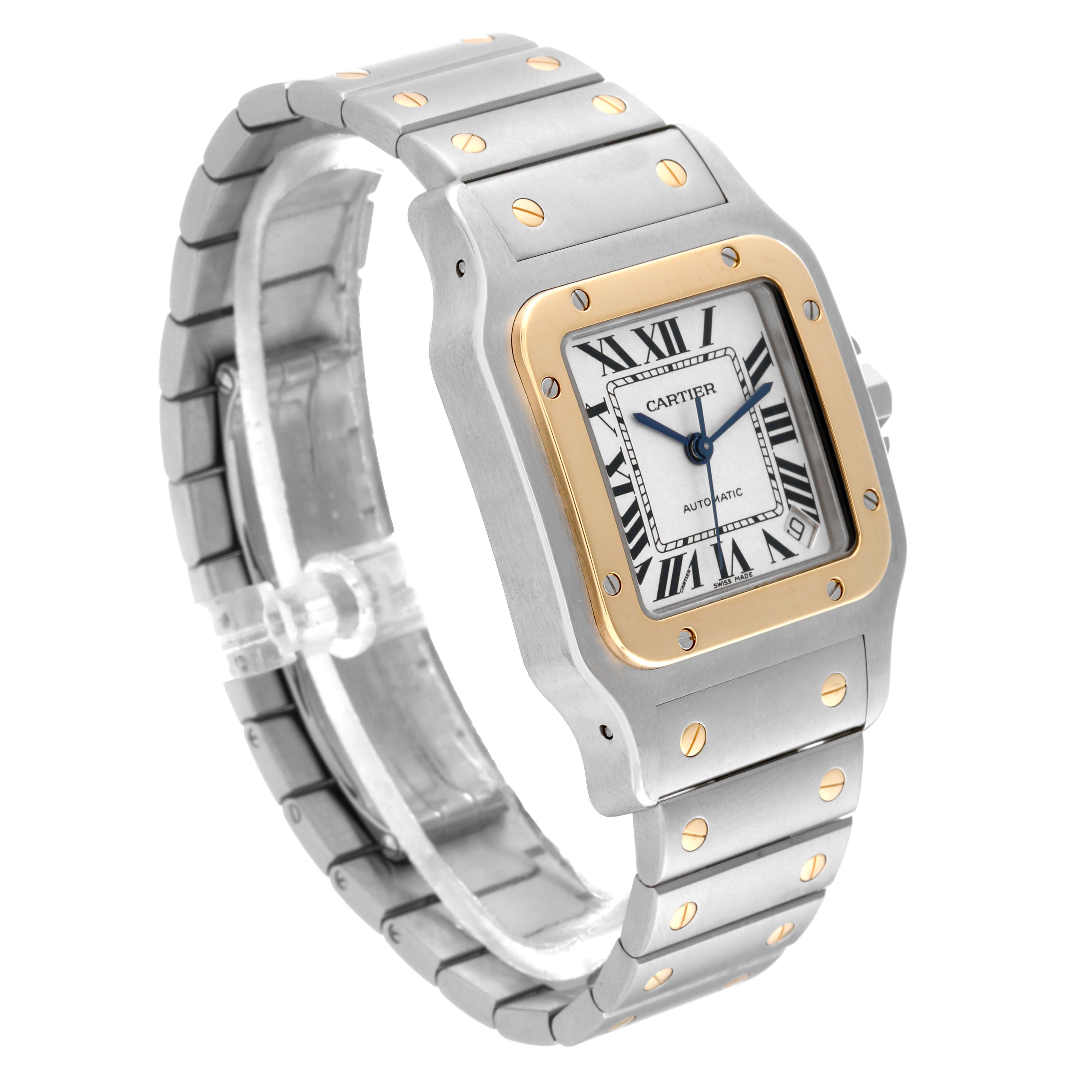 The image shows a side angle of the Cartier Santos W20099C4 Men
s Steel and Gold (two tone) Silver Dial W20099C4 Men
s Steel and Gold (two tone) Silver Dial watch, highlighting its case, bezel, bracelet, and dial.