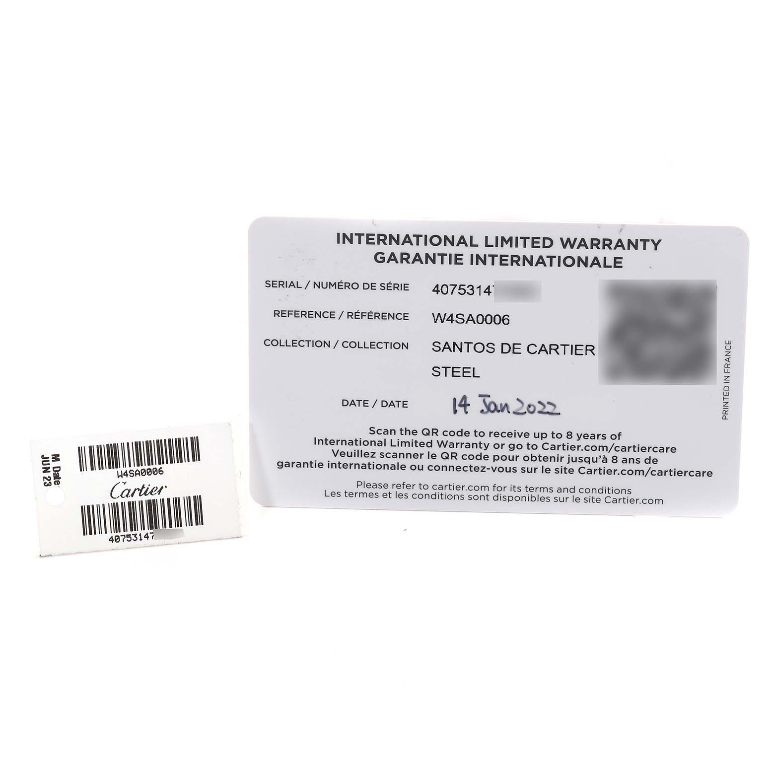 This image shows an International Limited Warranty card and a barcode label for a Santos model by Cartier.