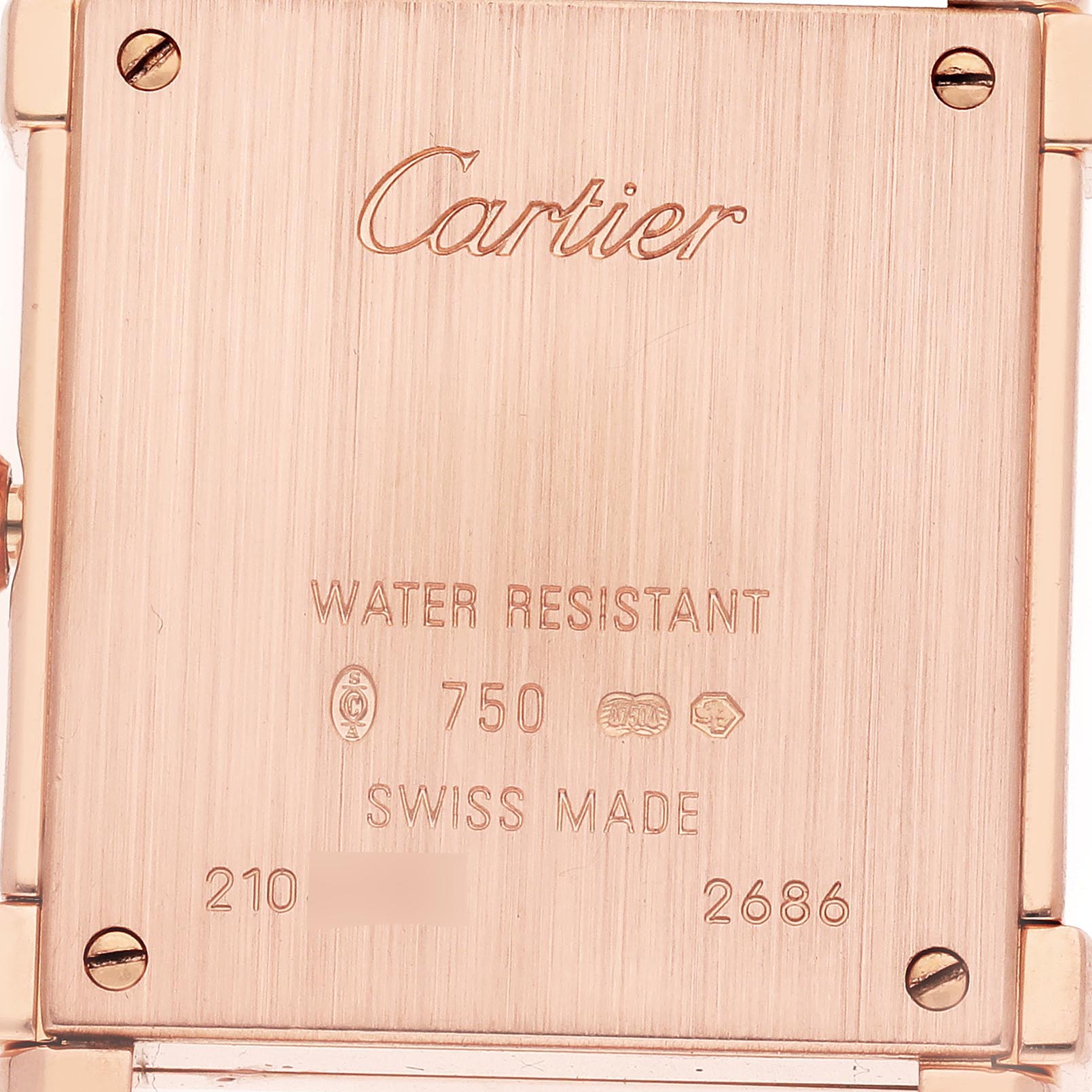 The image shows the back casing of a Cartier Tank Louis WE300131 Women's Rose Gold Silver Dial WE300131 Women's Rose Gold Silver Dial watch, highlighting the screws and engraved details.