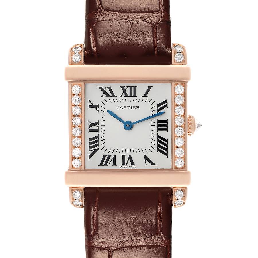 The Cartier Tank Louis watch is shown from the front, highlighting its rectangular face, Roman numerals, diamond-set bezel, and leather strap.