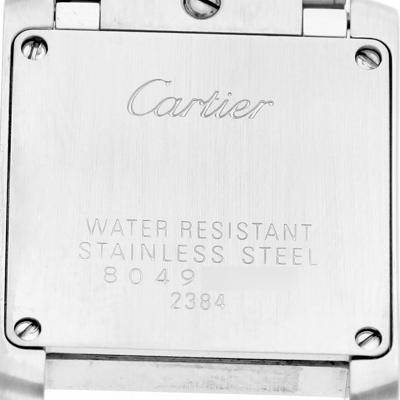 The image shows the back case of a Cartier Tank Francaise W51027Q4 Women's Steel and Gold (two tone) Mother of Pearl Dial watch, featuring engraved specifications and screws.