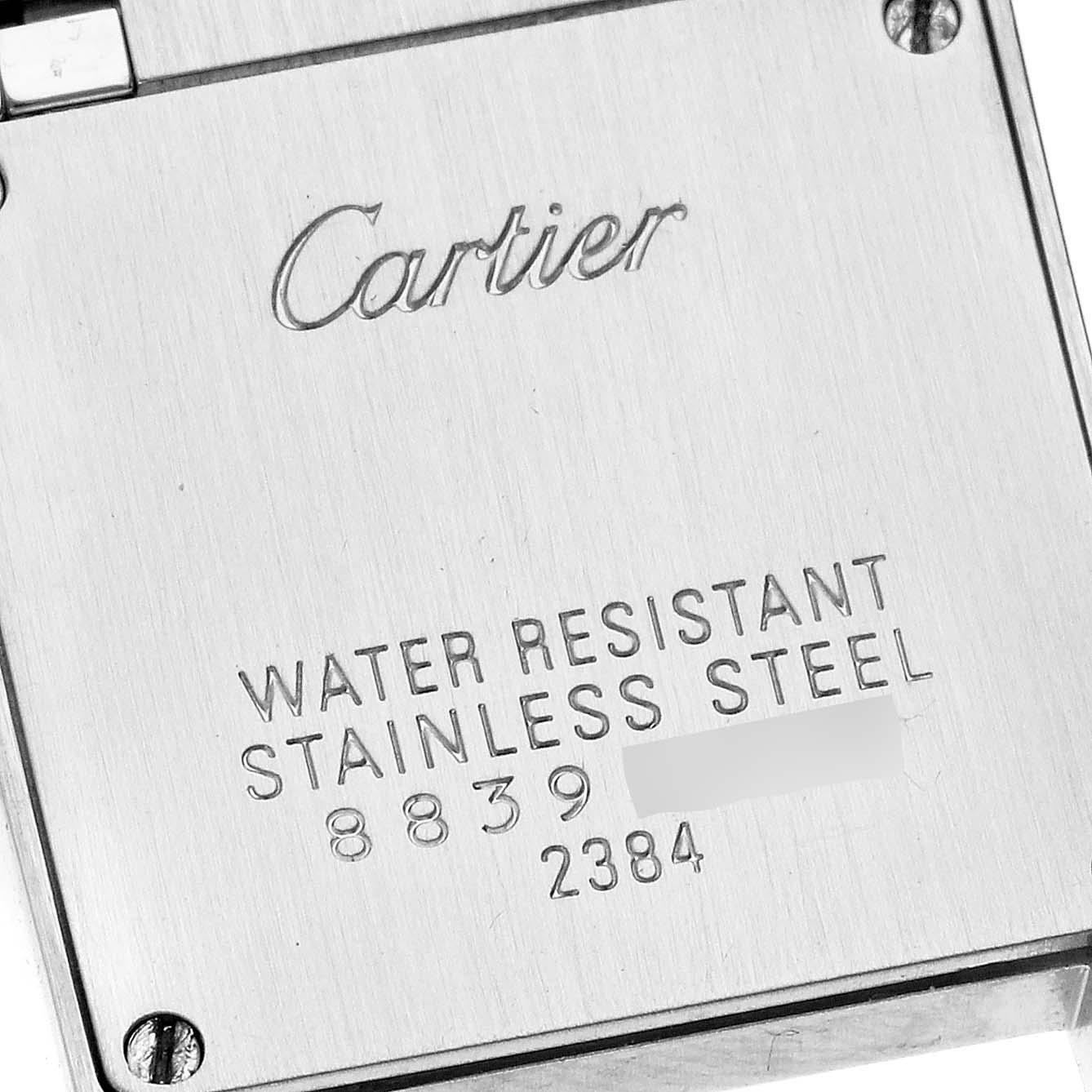 This image shows the stainless steel back case of a Cartier Tank Francaise W51027Q4 Women's Steel and Gold (two tone) Mother of Pearl Dial W51027Q4 Women's Steel and Gold (two tone) Mother of Pearl Dial watch.