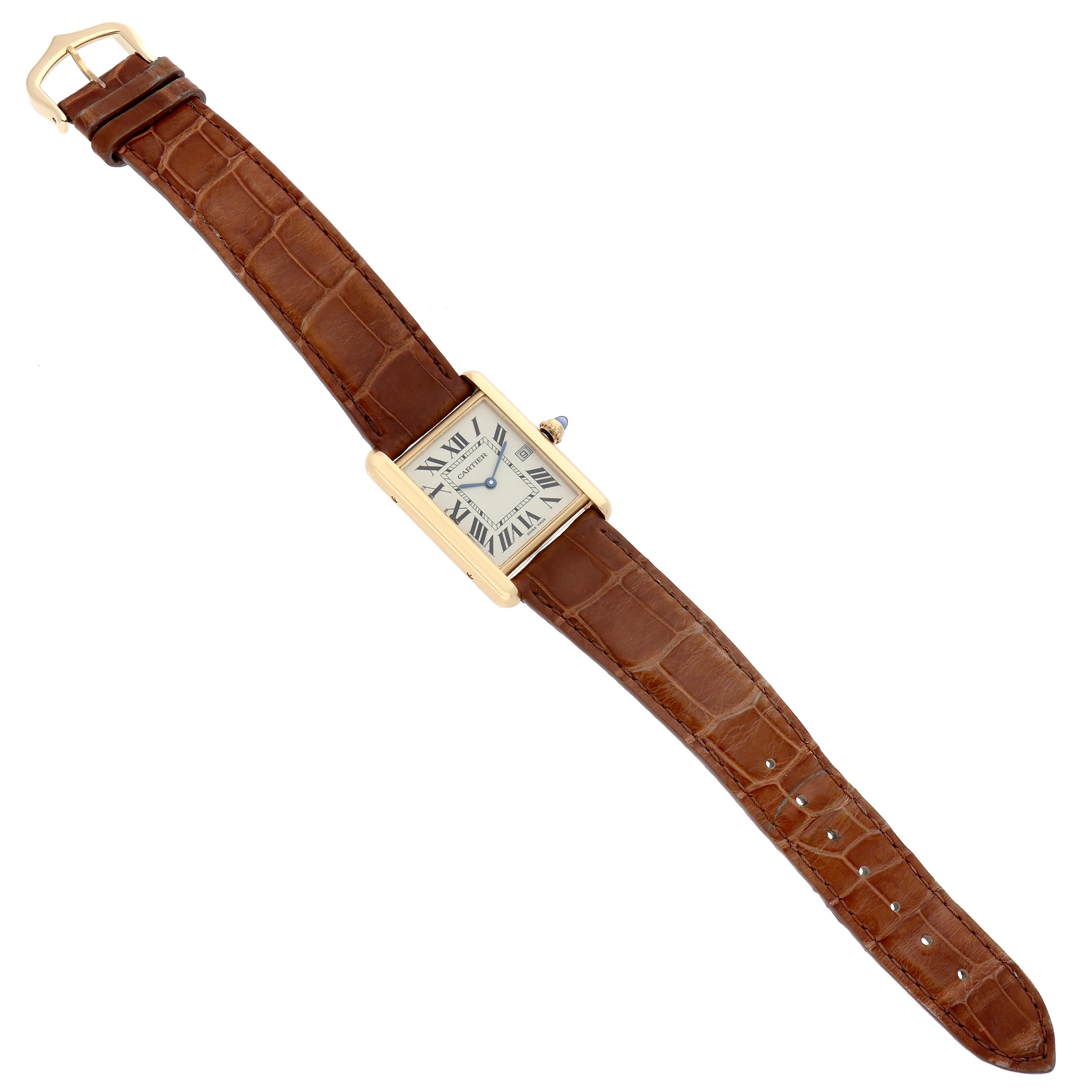 The Cartier Tank Louis W1529756 Men's Yellow Gold Silver Dial W1529756 Men's Yellow Gold Silver Dial watch is shown flat, displaying its rectangular face, Roman numerals, and brown leather strap.