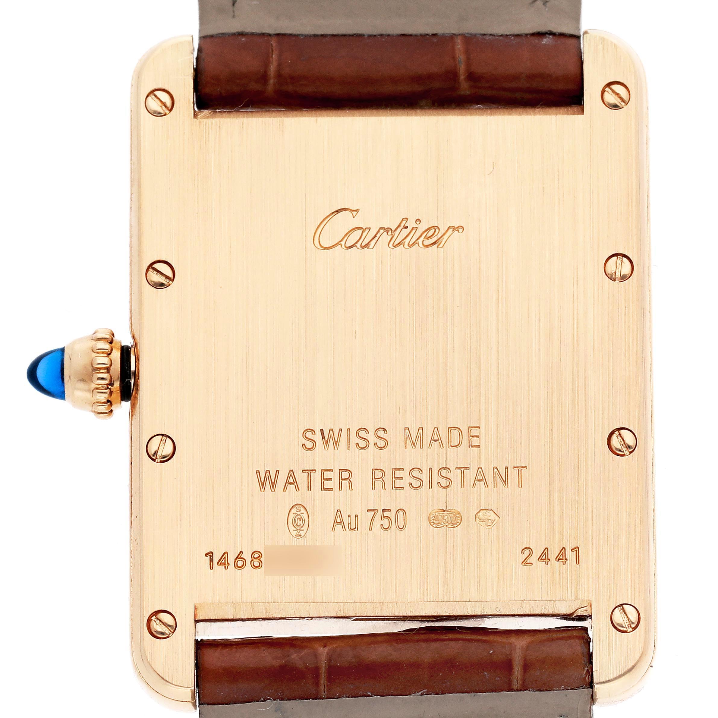 The image shows the back of a Tank Louis watch by Cartier, featuring engravings and the leather strap connection.
