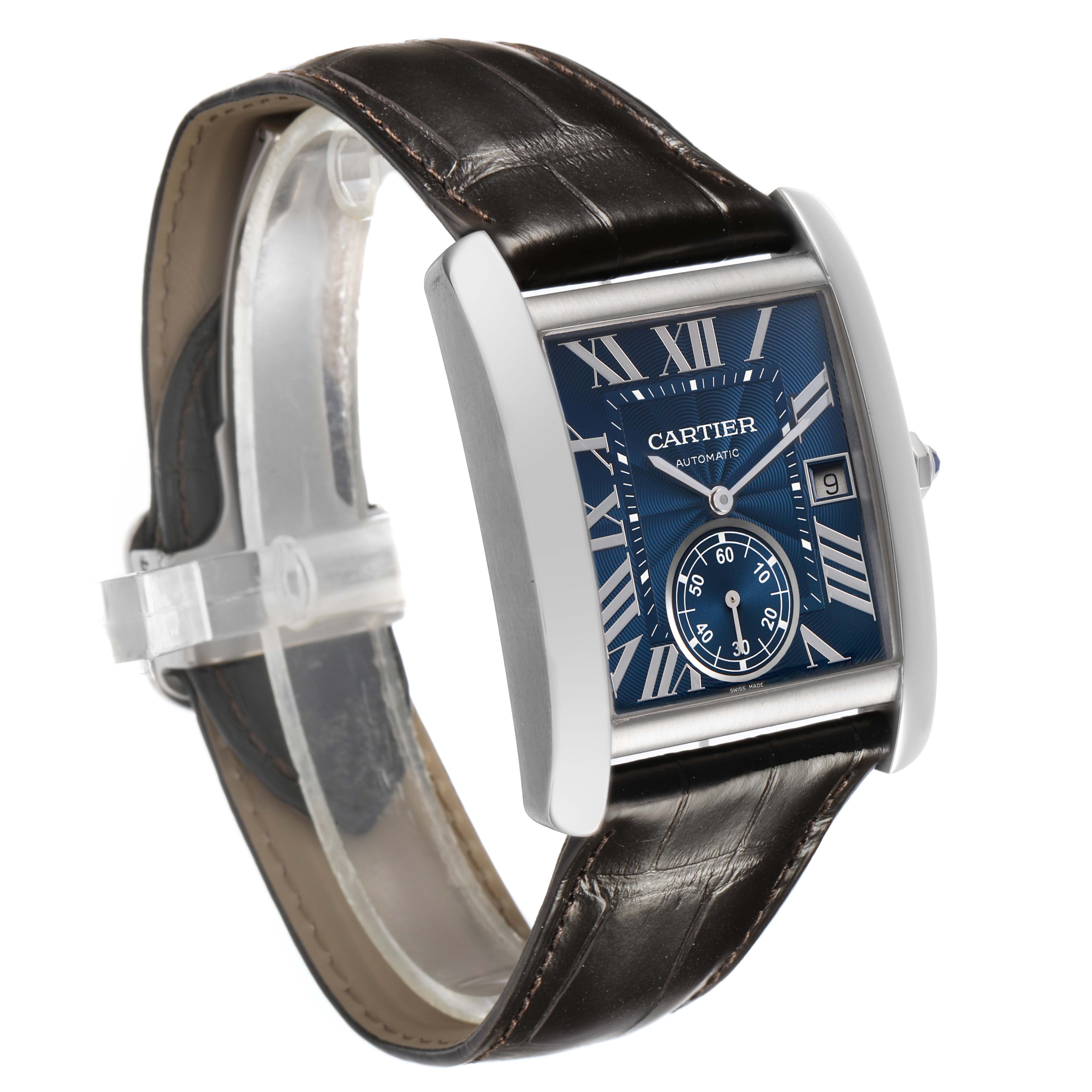 The Cartier Tank MC WSTA0010 Men's Stainless Steel Blue Dial watch is shown at a three-quarter angle, highlighting its blue dial, Roman numerals, and leather strap.