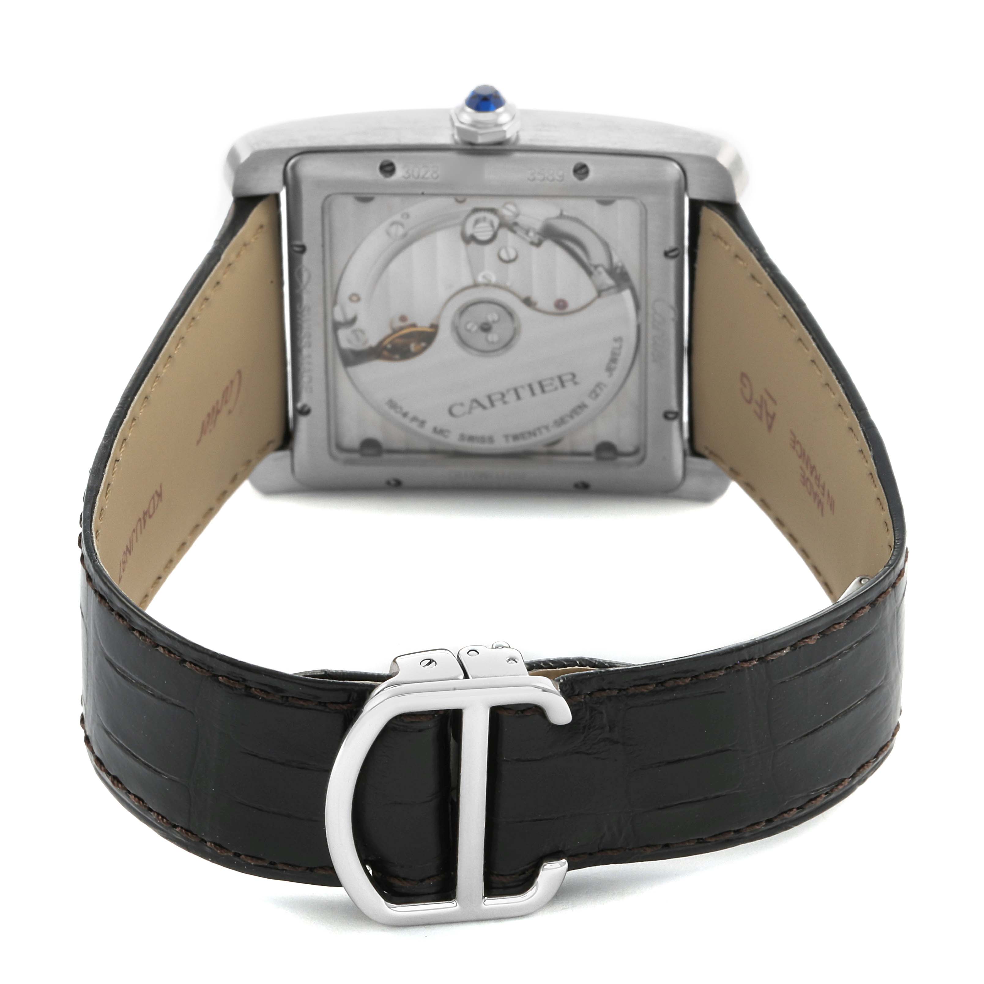 The image shows the back view of a Cartier Tank MC WSTA0010 Men's Stainless Steel Blue Dial watch, highlighting the case back, inner strap, and buckle.