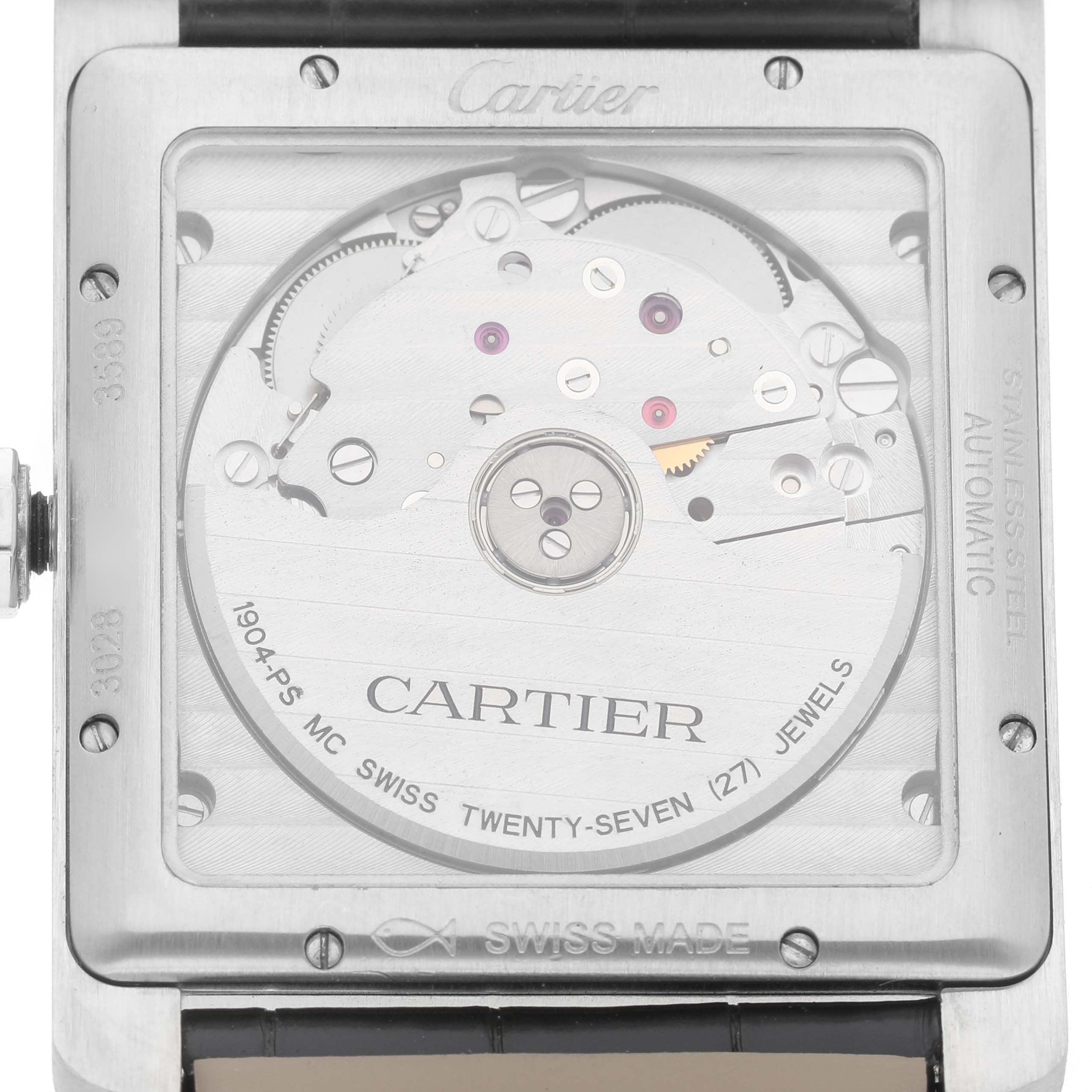 The image shows the back view of the Cartier Tank MC WSTA0010 Men's Stainless Steel Blue Dial watch, highlighting its automatic movement and interior mechanics.