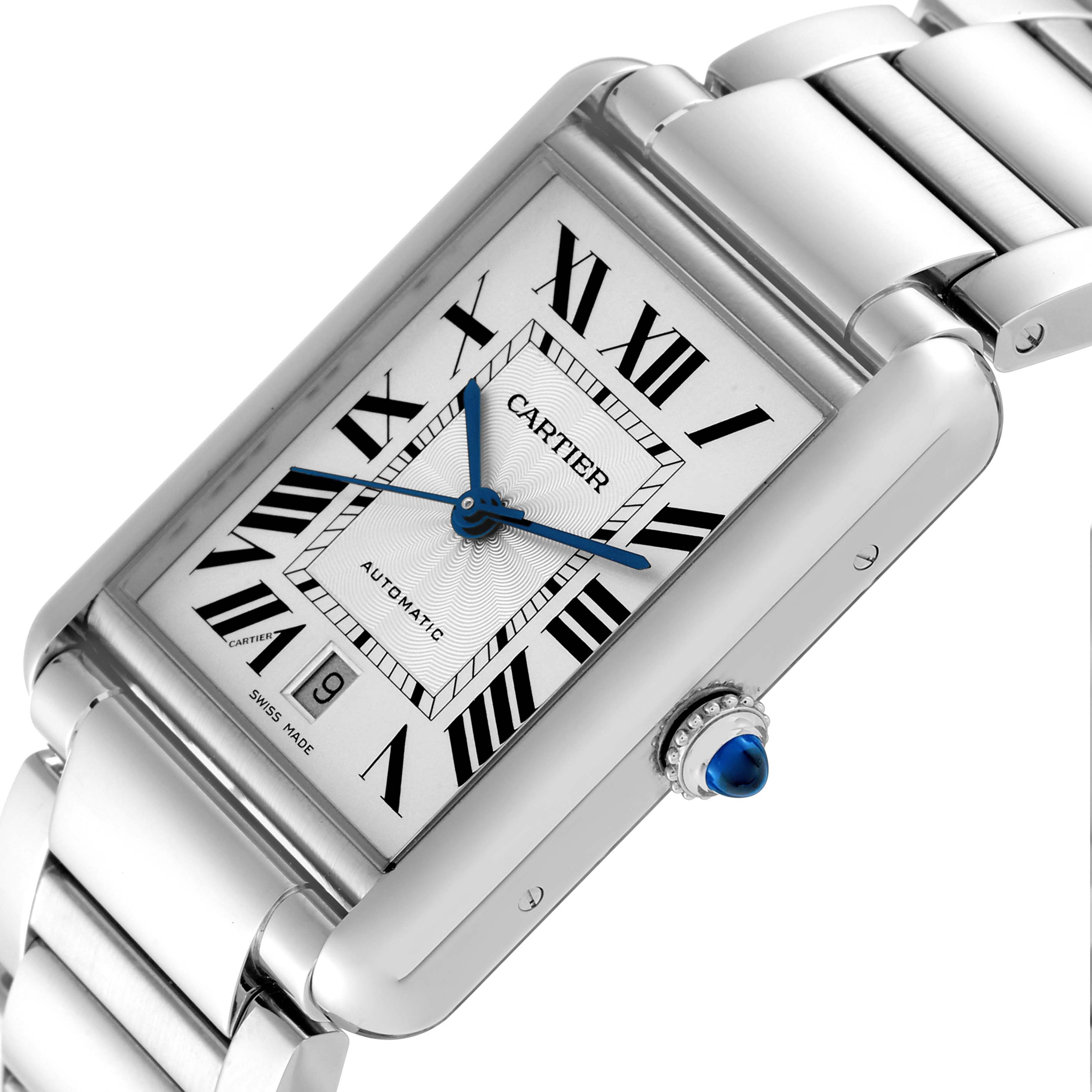 The image shows a Cartier Tank Must WSTA0053 Men
s Stainless Steel Silver Dial WSTA0053 Men
s Stainless Steel Silver Dial watch from an angled top view, highlighting its dial, blue hands, Roman numerals, and crown with a blue cabochon.