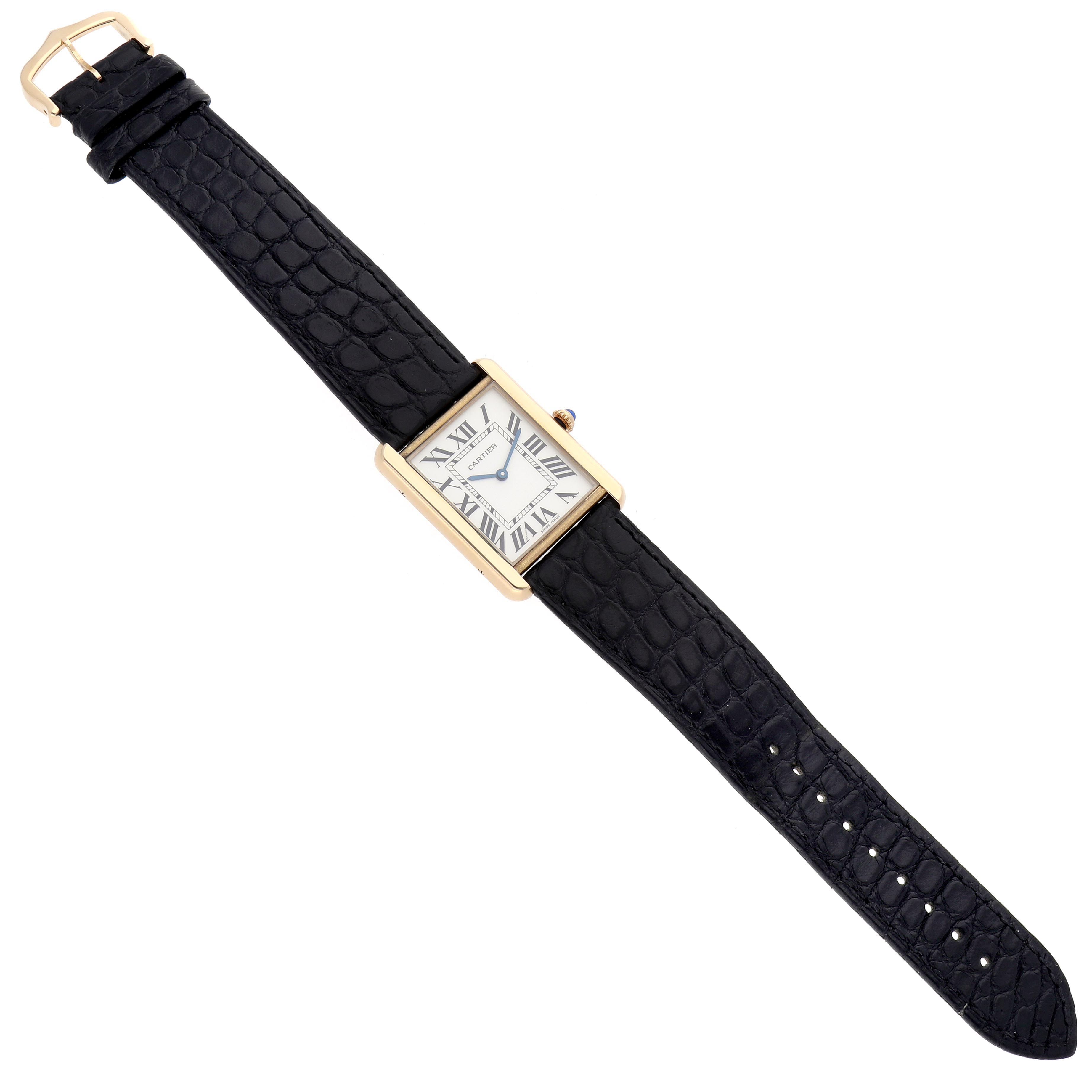 The Cartier Tank Solo W5200004 Men's Steel and Gold (two tone) Silver Dial W5200004 Men's Steel and Gold (two tone) Silver Dial watch is shown in a top-down angle, displaying its rectangular face and black leather strap.