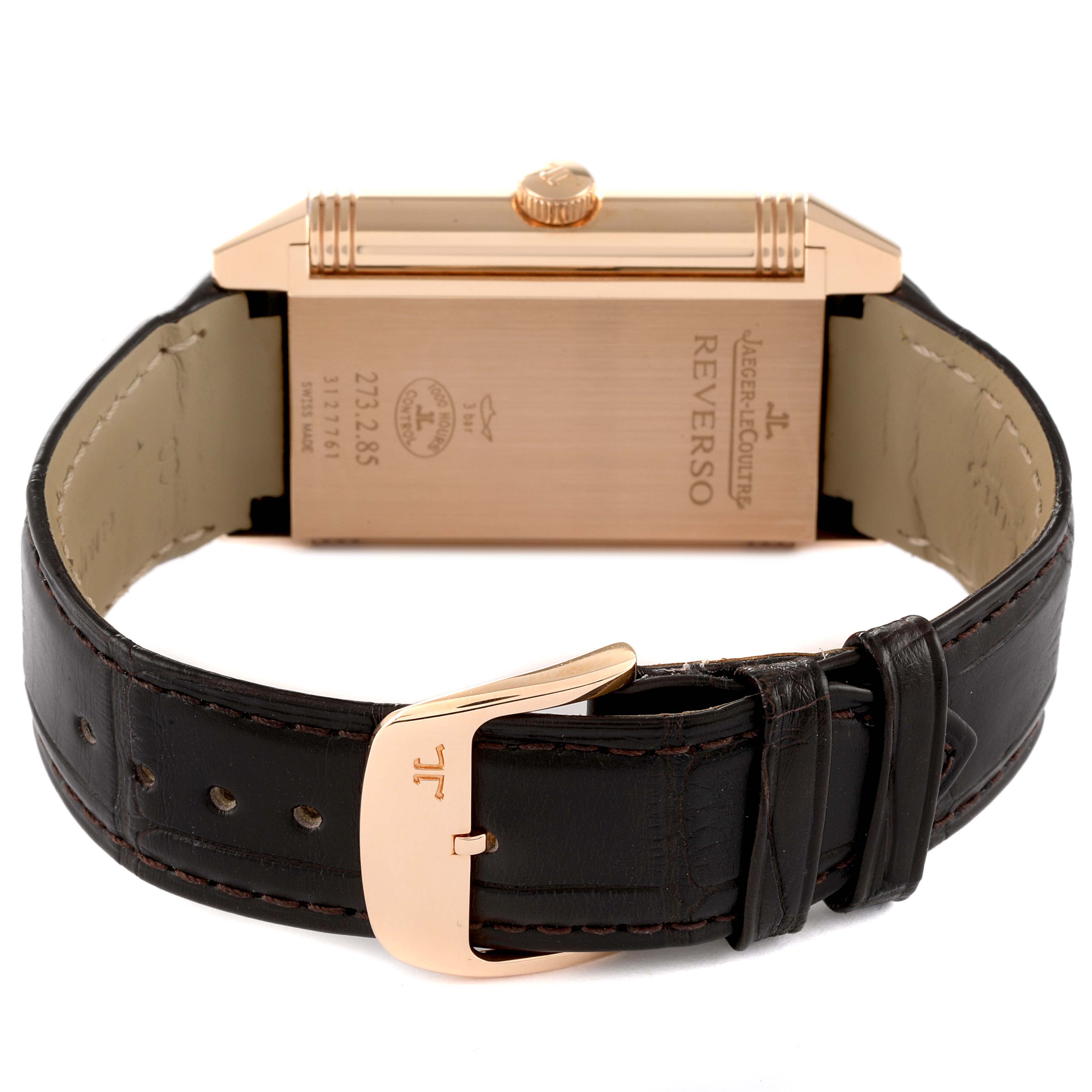 This image shows the back view of a Jaeger LeCoultre Reverso Q3742521 Men
s Rose Gold Silver Dial Q3742521 Men
s Rose Gold Silver Dial watch with a black leather strap and gold buckle.