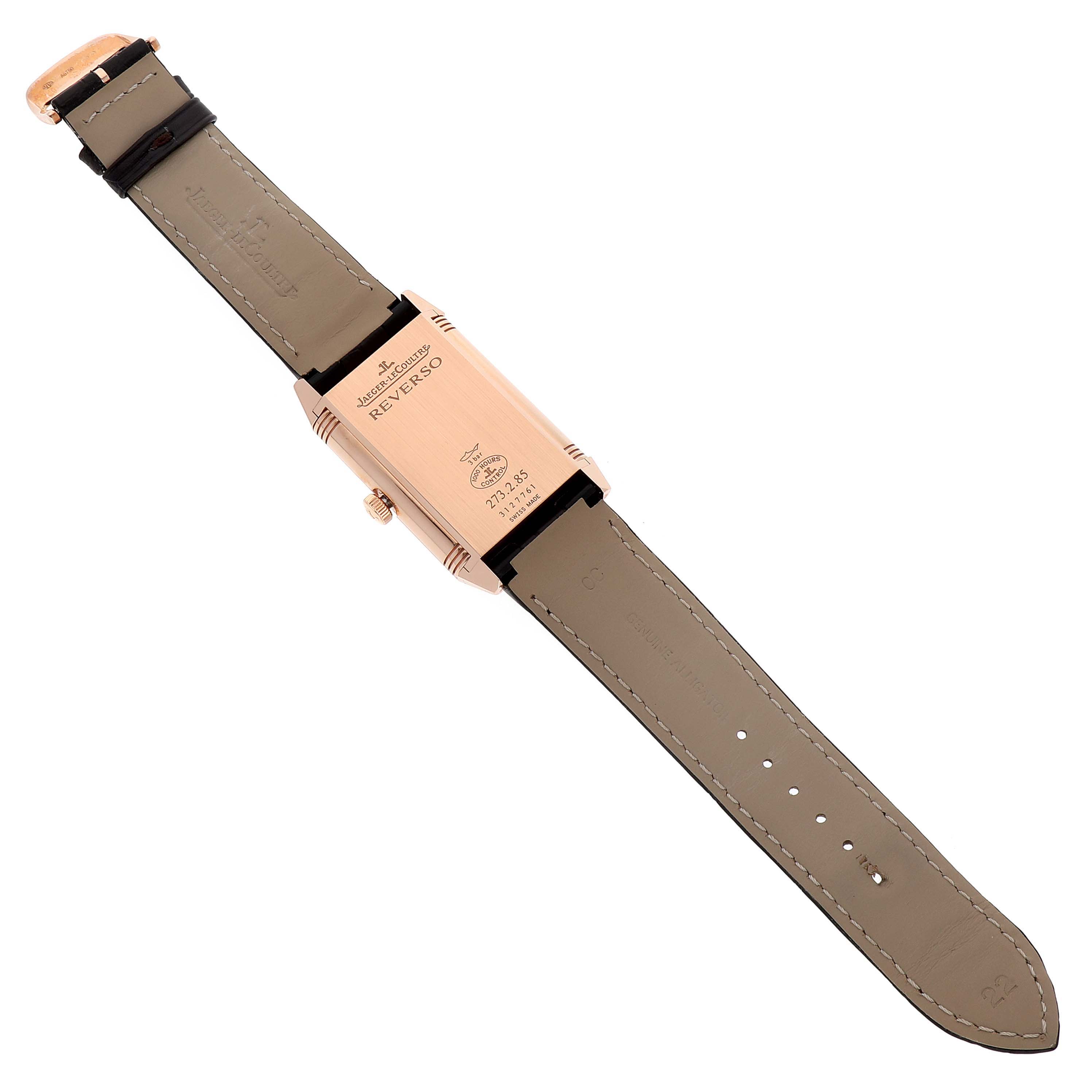 The image shows the back view of a Jaeger LeCoultre Reverso Q3742521 Men
s Rose Gold Silver Dial Q3742521 Men
s Rose Gold Silver Dial watch, displaying the case back and leather strap laid flat.