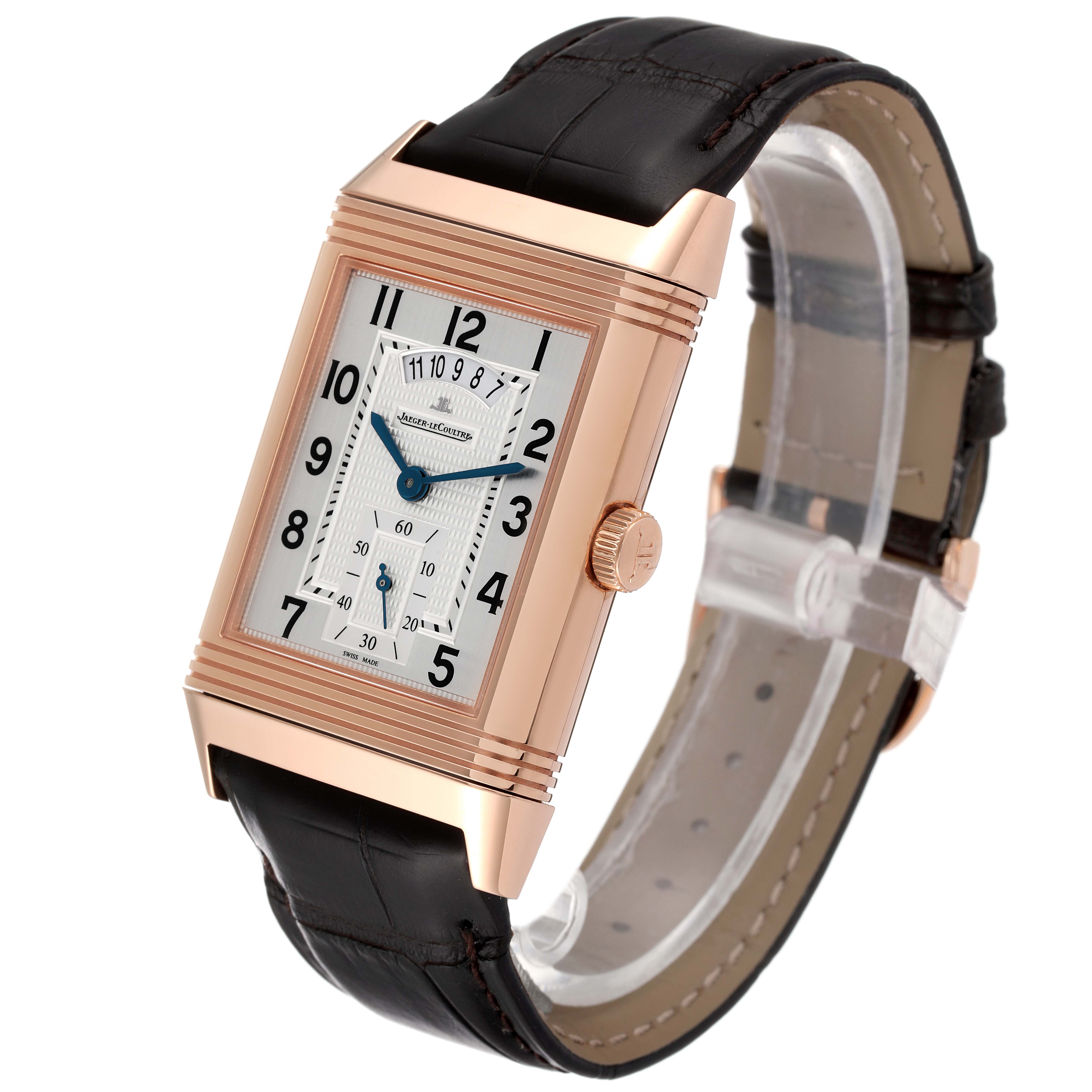 This Jaeger LeCoultre Reverso Q3742521 Men
s Rose Gold Silver Dial Q3742521 Men
s Rose Gold Silver Dial watch is shown at an angled side view, highlighting the rectangular face, crown, and leather strap.