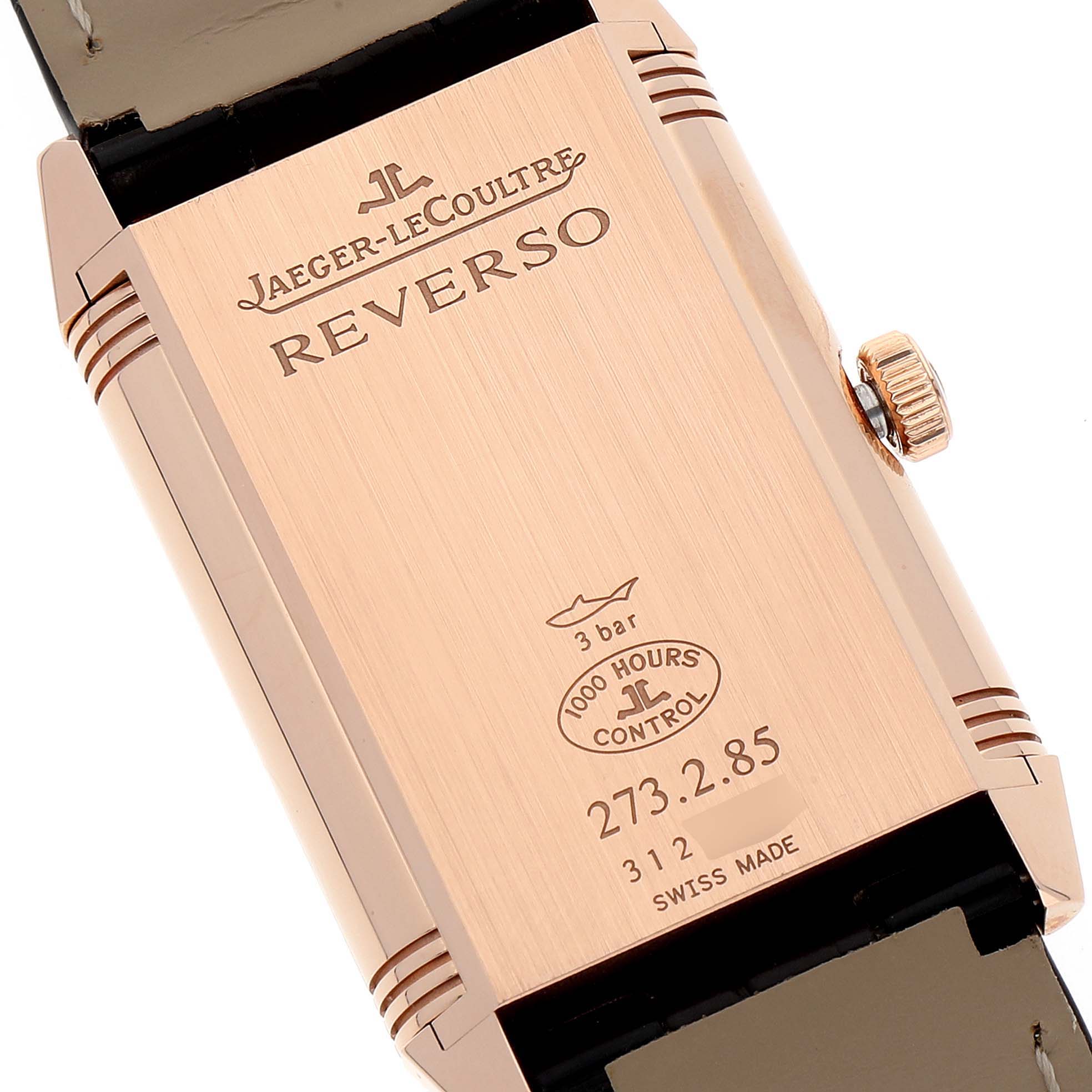 The image shows the back of a Jaeger-LeCoultre Reverso watch, highlighting the case details, branding, and engravings.