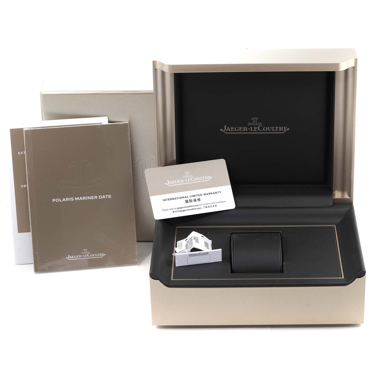 The image shows the open packaging for the Jaeger-LeCoultre Polaris Mariner Date, including the box, manuals, and warranty card.