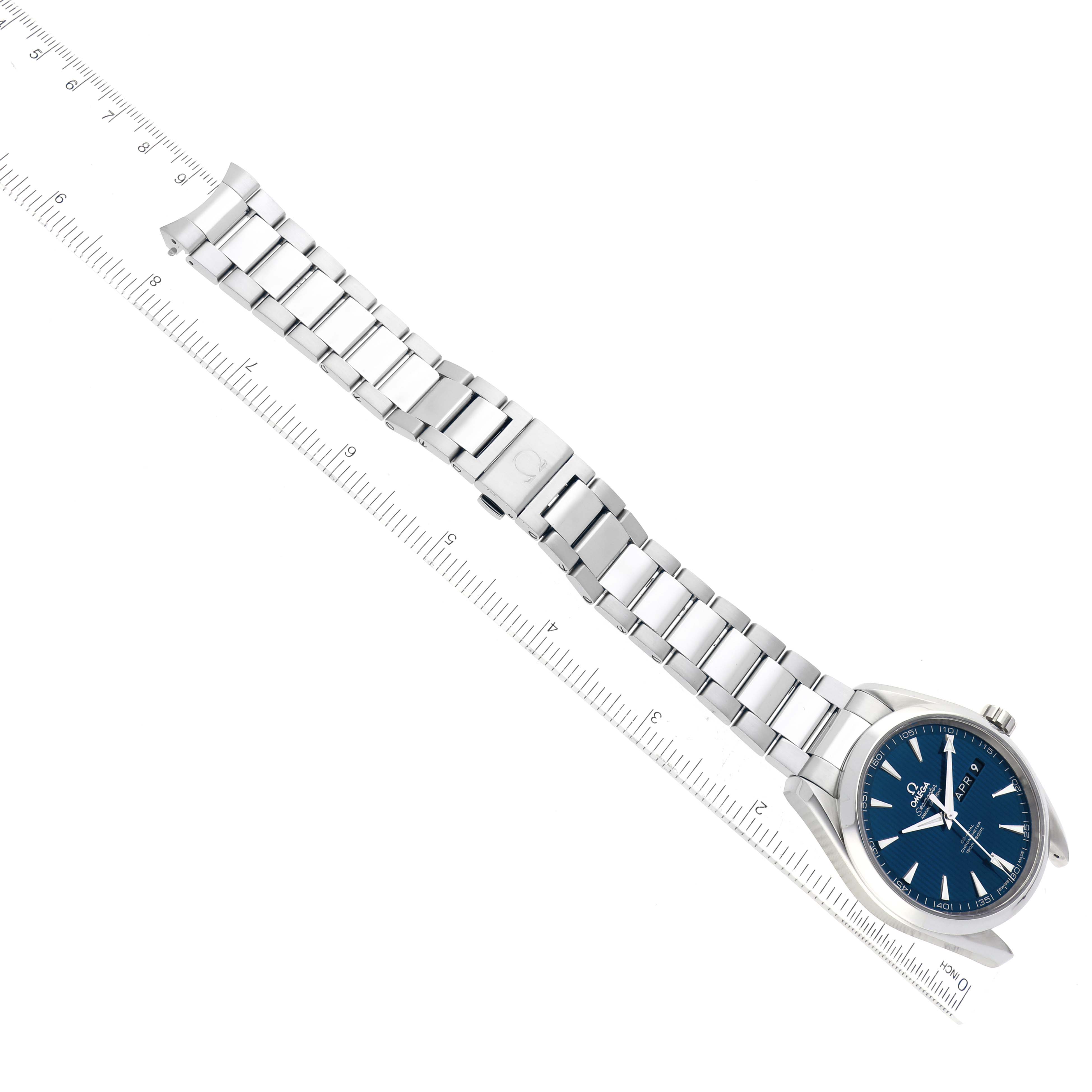 The image shows the Omega Aqua Terra 231.10.43.22.03.002 Men
s Stainless Steel Blue Dial 231.10.43.22.03.002 Men
s Stainless Steel Blue Dial watch from an overhead angle, highlighting the watch face, band, and ruler measurements.