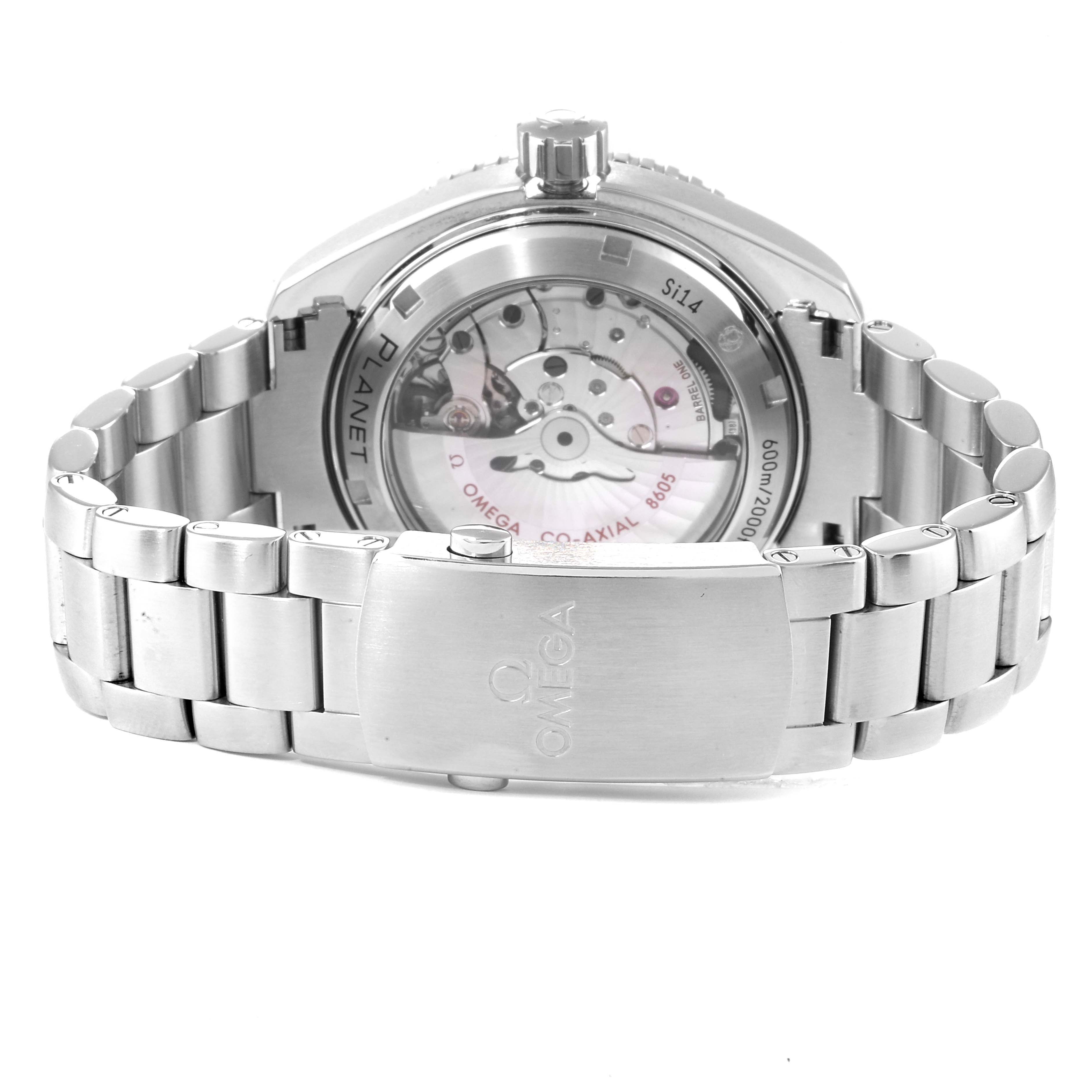 The image shows the back view of the Omega Planet Ocean 232.30.44.22.01.001 Men
s Stainless Steel Black Dial 232.30.44.22.01.001 Men
s Stainless Steel Black Dial watch, highlighting the bracelet, case back, and movement.