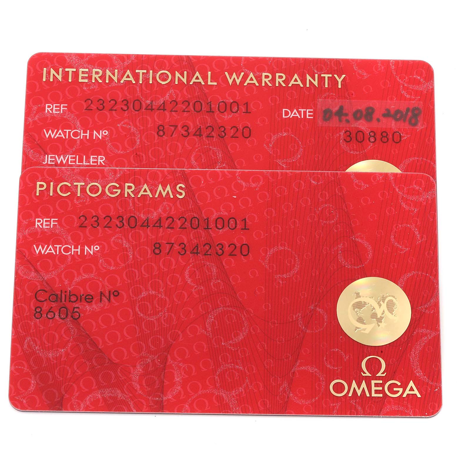 The image shows warranty and pictogram cards for the Omega Planet Ocean 232.30.44.22.01.001 Men
s Stainless Steel Black Dial 232.30.44.22.01.001 Men
s Stainless Steel Black Dial model, displaying reference numbers and other details.