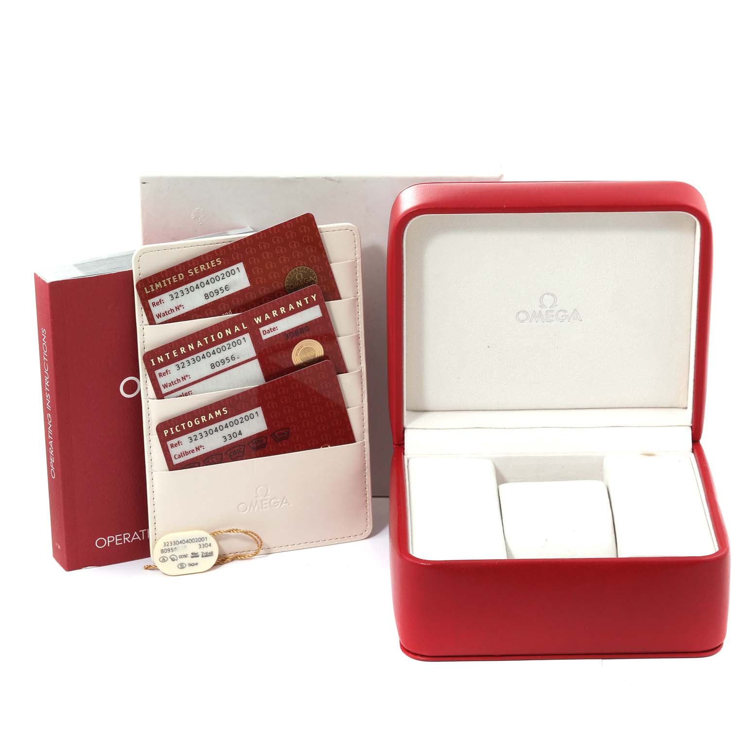 The image shows an Omega Speedmaster 323.30.40.40.02.001 Men
s Stainless Steel Silver Dial 323.30.40.40.02.001 Men
s Stainless Steel Silver Dial watch box, operating instructions, warranty cards, and accessory holder.