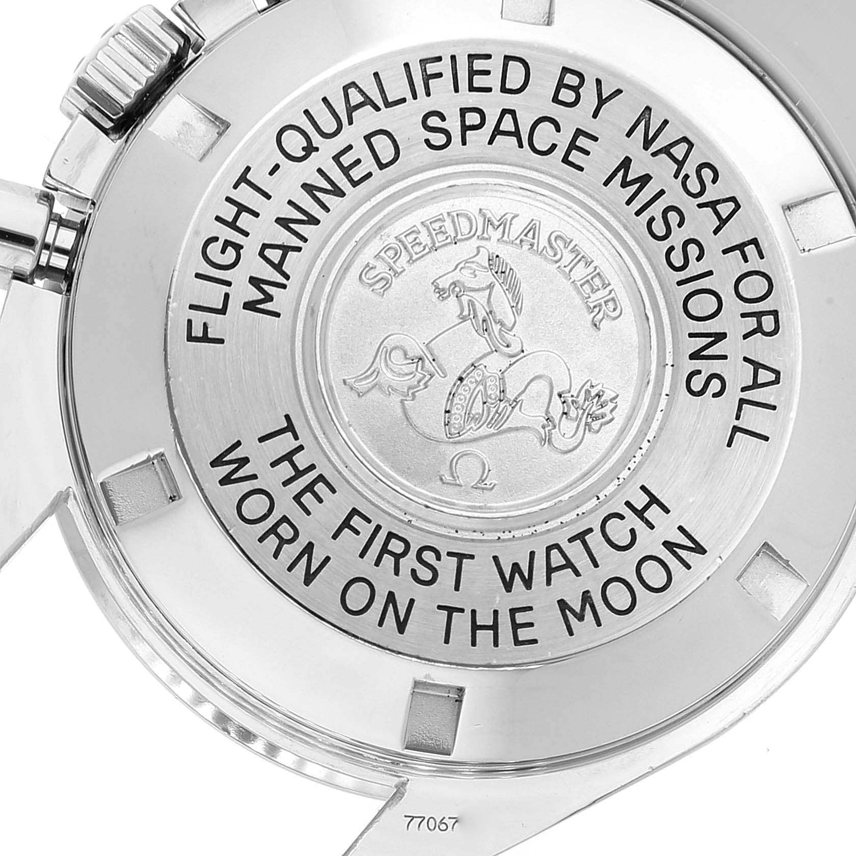 A rear view of an Omega Speedmaster 3575.20.00 Men
s Stainless Steel White Dial 3575.20.00 Men
s Stainless Steel White Dial watch showing the engraved case back with inscriptions and the emblem.