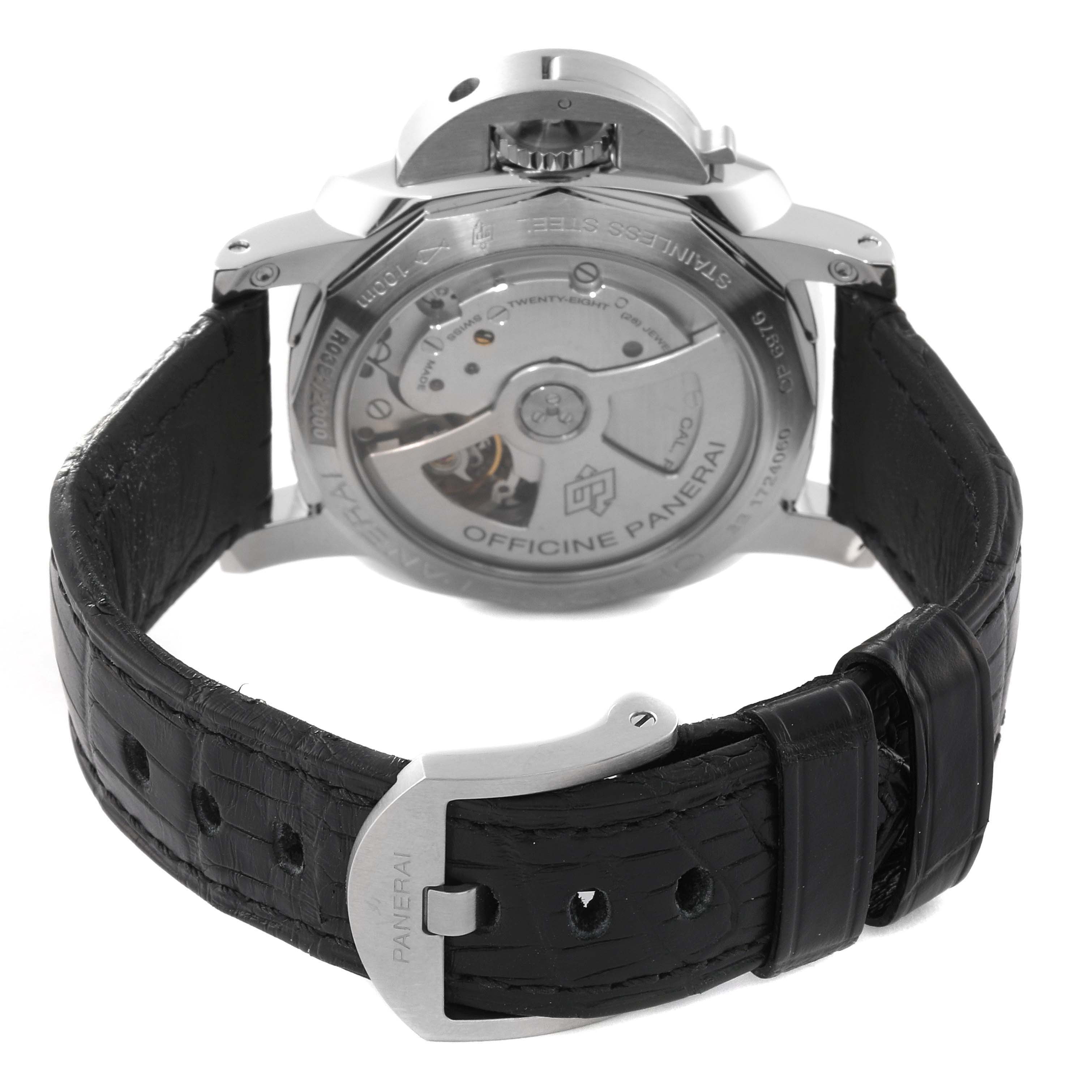 The image shows the back case and buckle of a Luminor model watch by Panerai, highlighting the movement and leather strap.