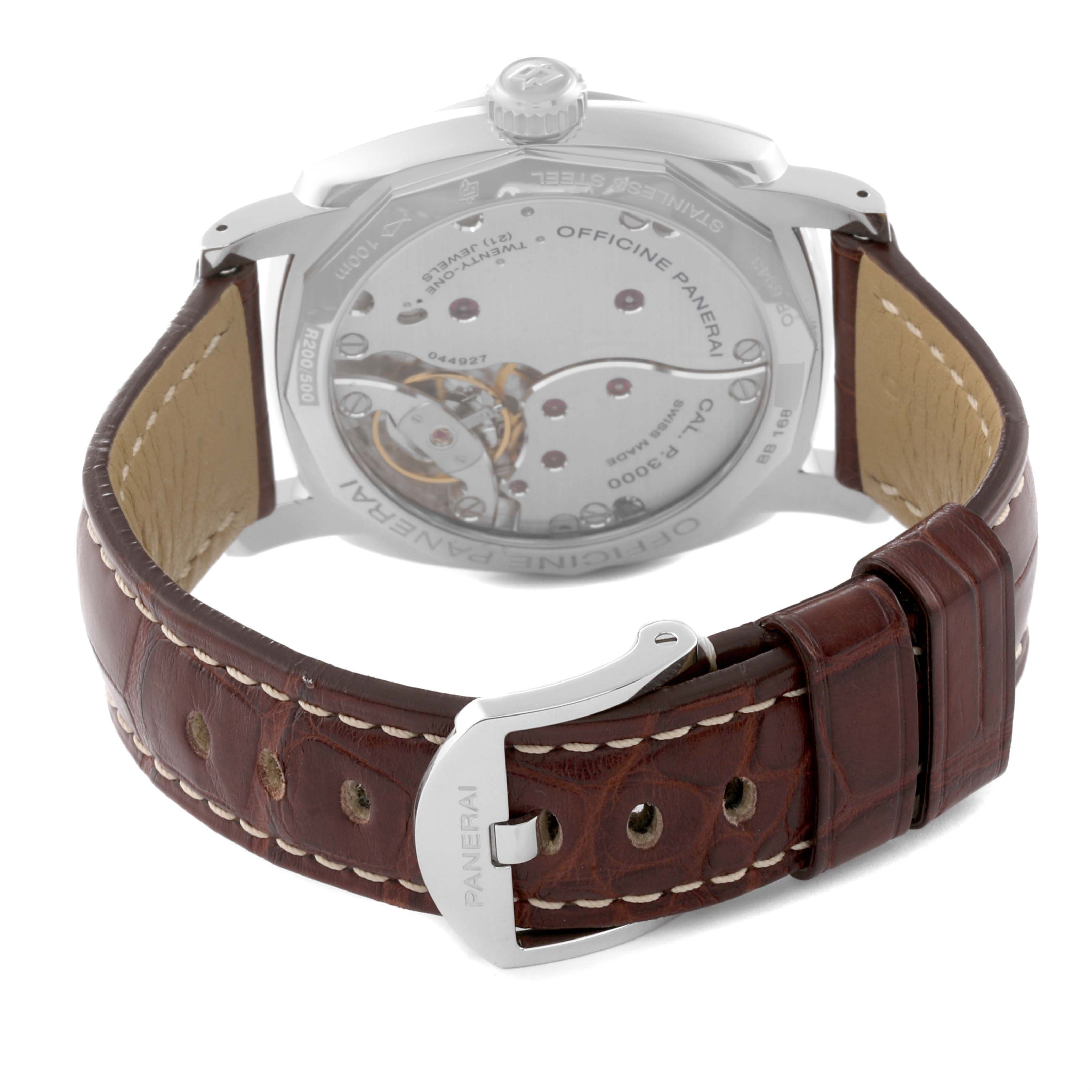 The image shows the back view of a Radiomir model by Panerai, focusing on its transparent case back and brown leather strap with a buckle.