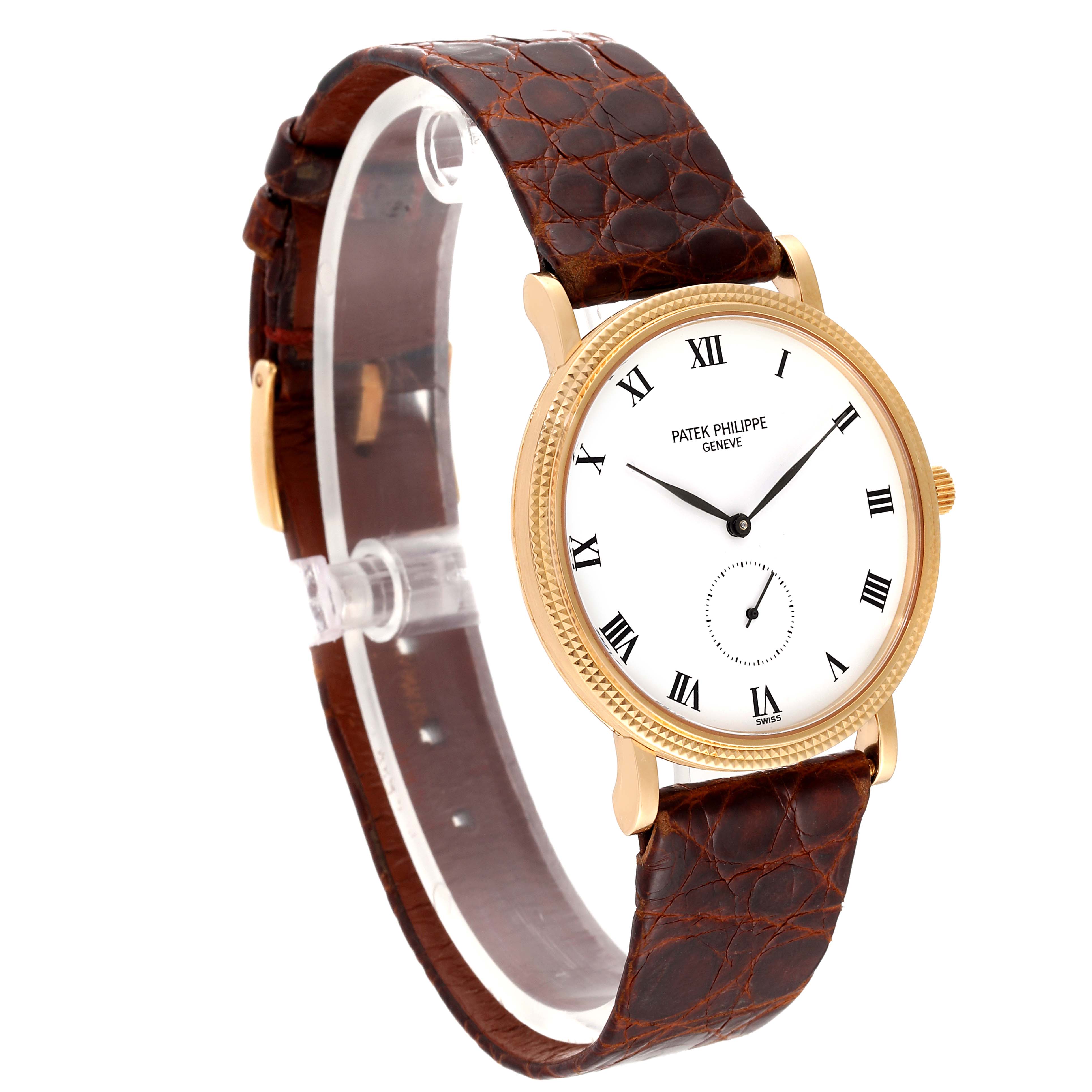 This image shows a Patek Philippe Calatrava 3919J Men's Yellow Gold White Dial 3919J Men's Yellow Gold White Dial watch at a slightly angled side view, displaying the dial, casing, and leather strap.