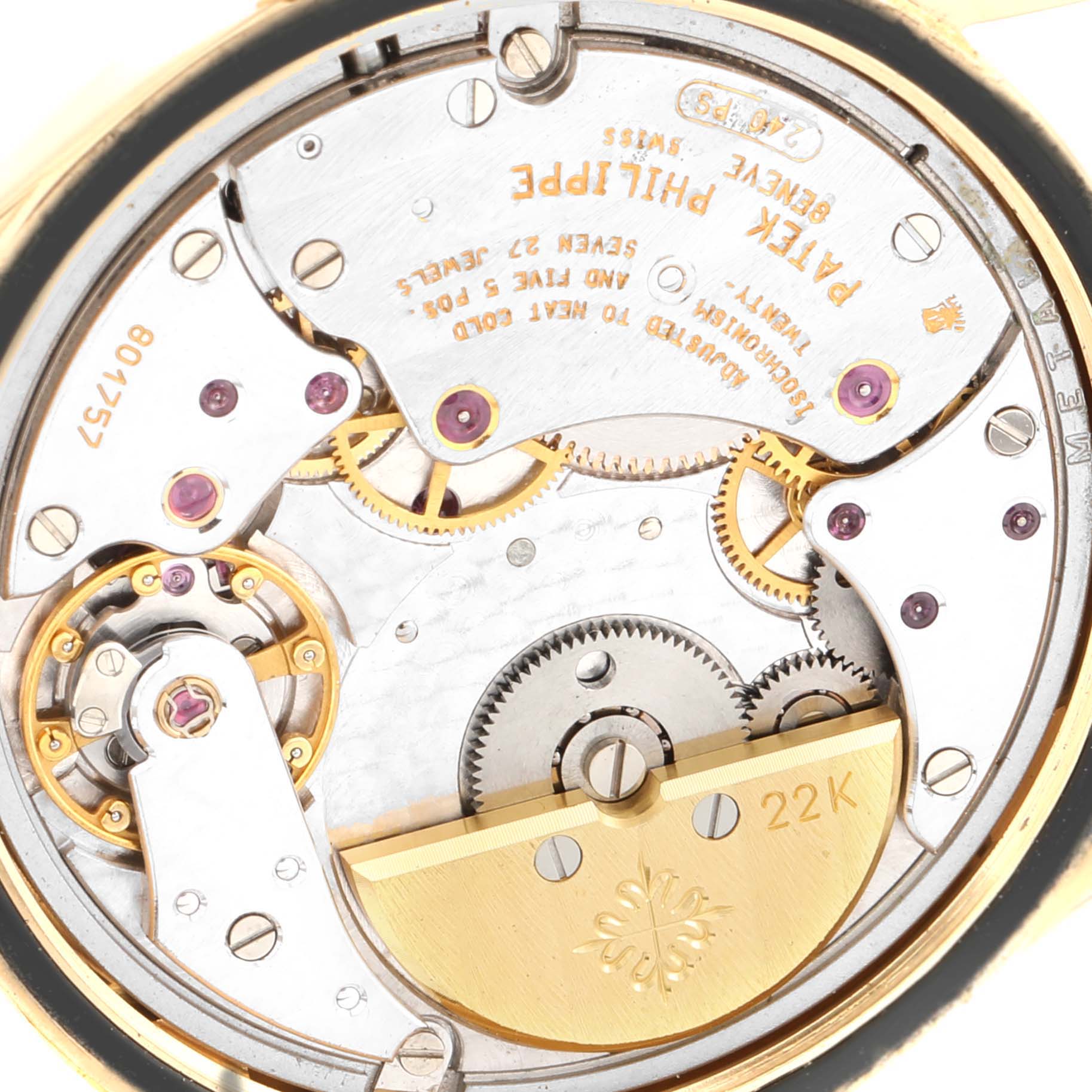 This image shows the intricate mechanical movement of a Patek Philippe Calatrava 5000J Men's Yellow Gold Black Dial 5000J Men's Yellow Gold Black Dial watch, focusing on its internal components.