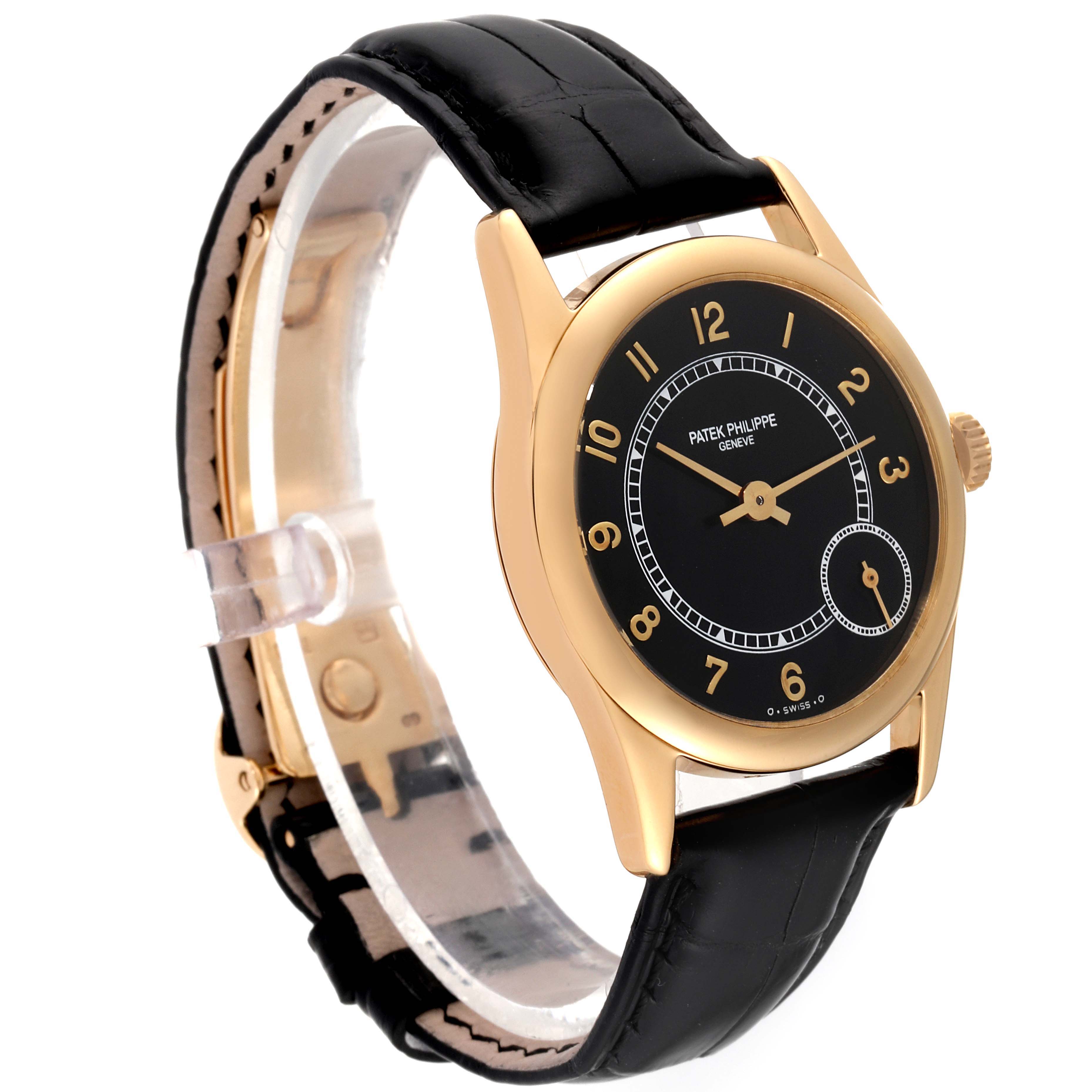 The image shows a side angle of a Patek Philippe Calatrava 5000J Men's Yellow Gold Black Dial 5000J Men's Yellow Gold Black Dial watch, highlighting the black dial and gold case with a black leather strap.