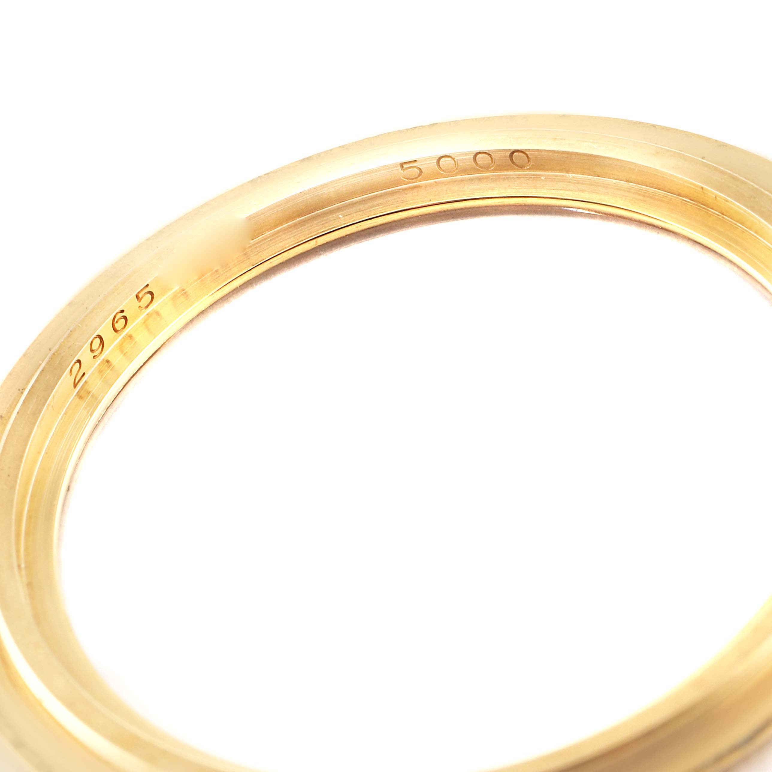 This image shows a close-up of the inner bezel of a Patek Philippe Calatrava 5000J Men's Yellow Gold Black Dial 5000J Men's Yellow Gold Black Dial watch, featuring engraved numbers.