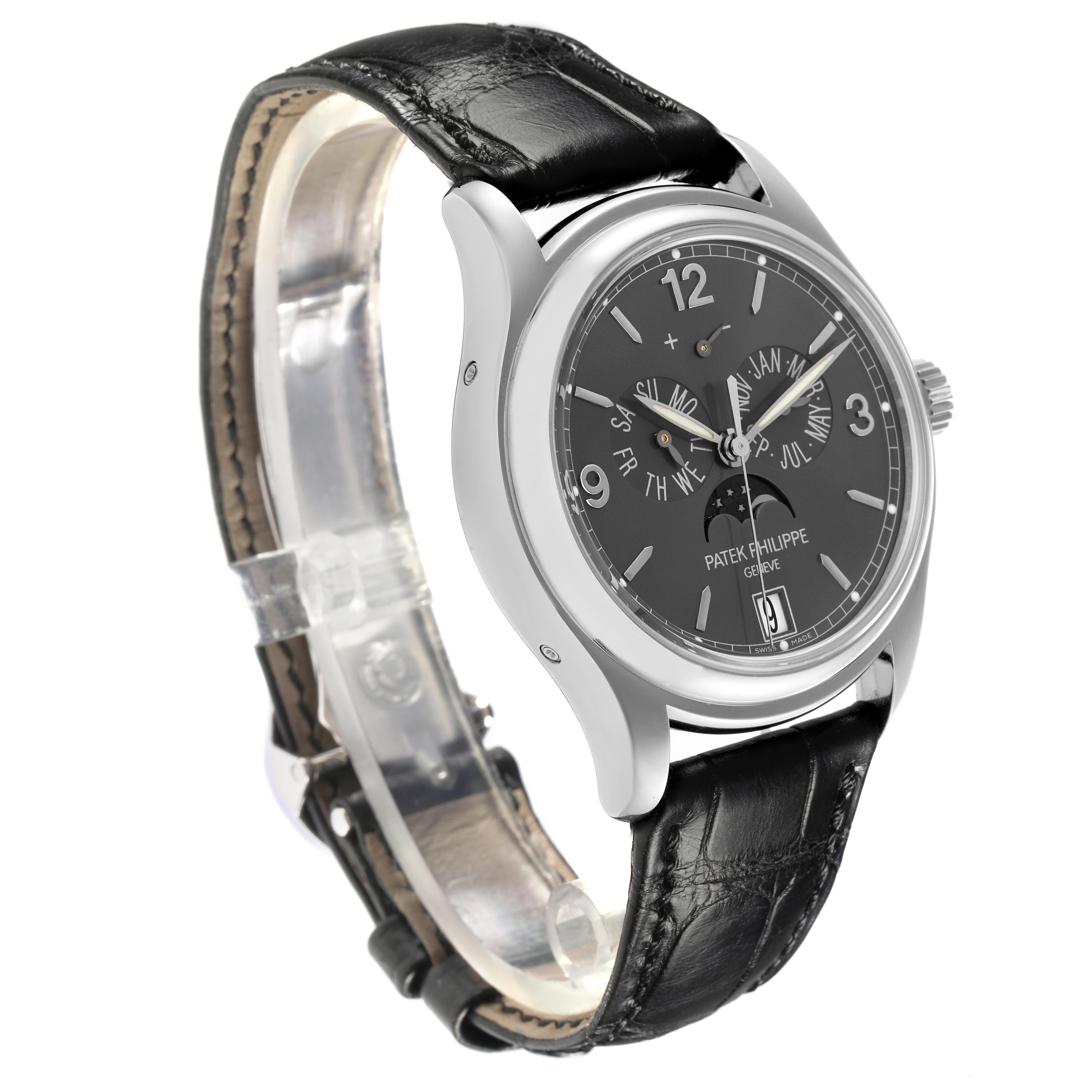 The Patek Philippe Complications 5146G-010 Men's White Gold Grey Dial 5146G-010 Men's White Gold Grey Dial watch is shown at a three-quarter angle, highlighting the dial, case, and leather strap.