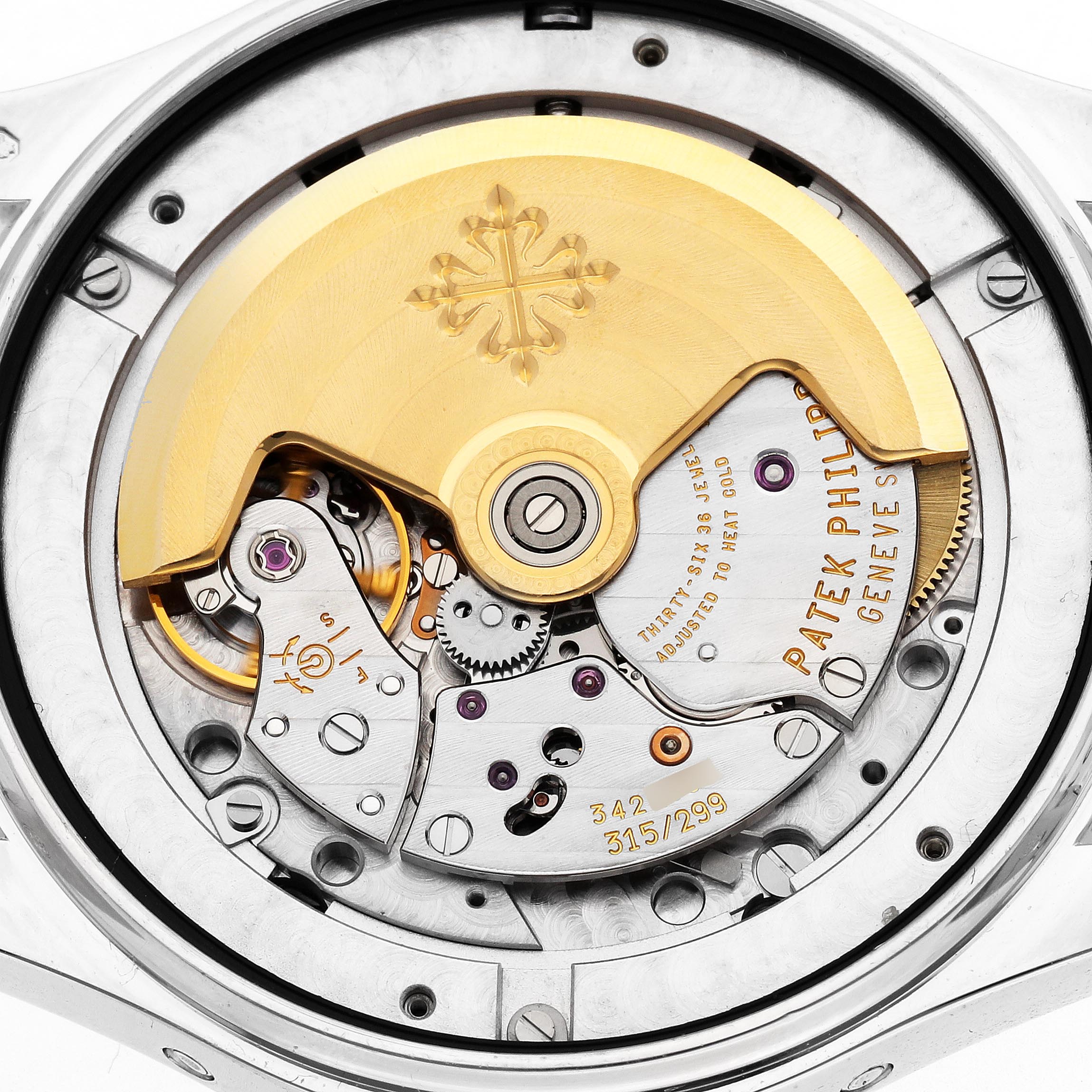 The image shows the movement of a Patek Philippe Complications 5146G-010 Men's White Gold Grey Dial 5146G-010 Men's White Gold Grey Dial watch from a rear angle, highlighting the rotor and intricate mechanics.
