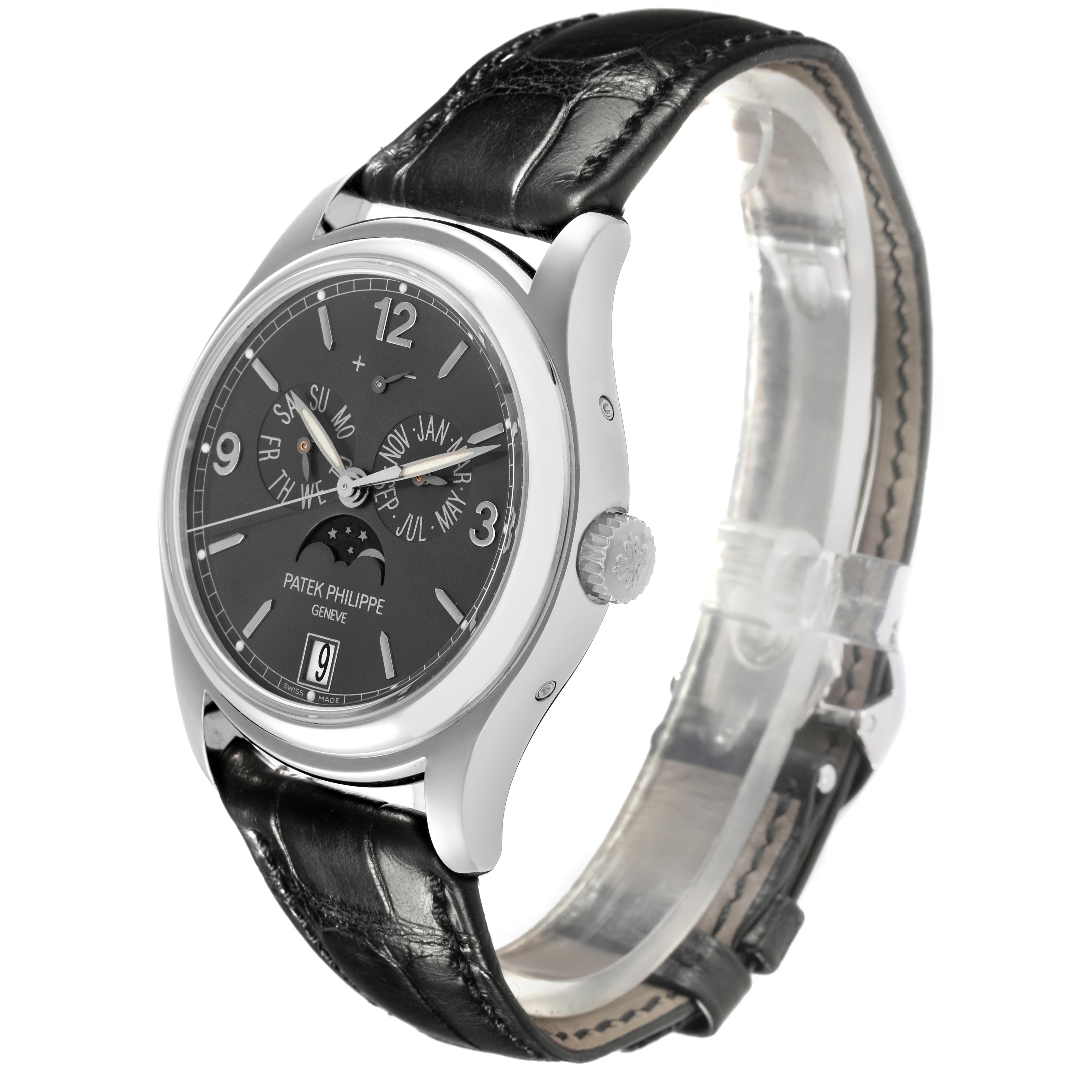 The Patek Philippe Complications 5146G-010 Men's White Gold Grey Dial 5146G-010 Men's White Gold Grey Dial watch is shown at a three-quarter angle, displaying the face, case, crown, and leather strap.