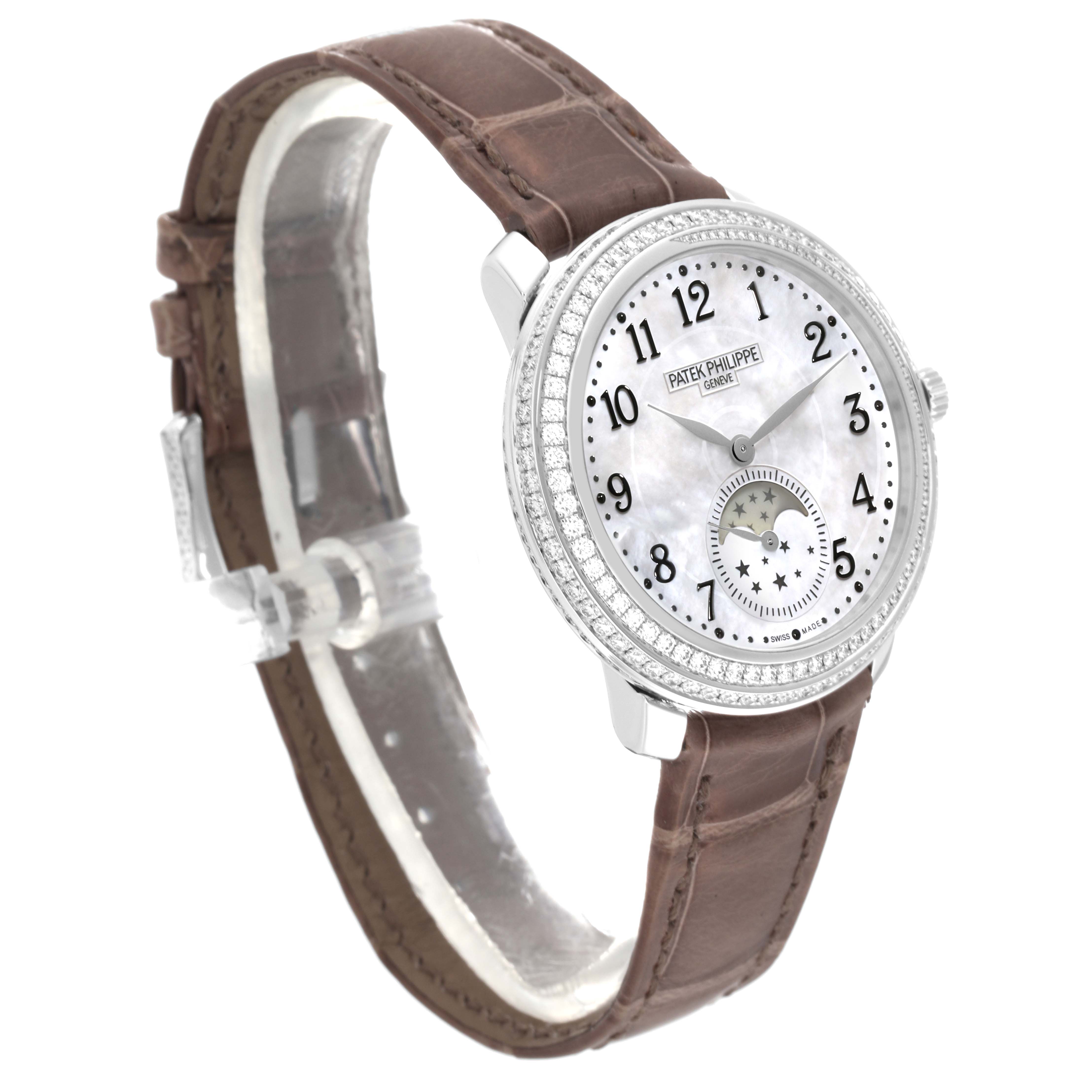 The image shows a side-front angle of the Patek Philippe Complications 4968G-010 Women's White Gold Mother of Pearl Dial 4968G-010 Women's White Gold Mother of Pearl Dial watch, displaying its dial, bezel, case, and brown leather strap.