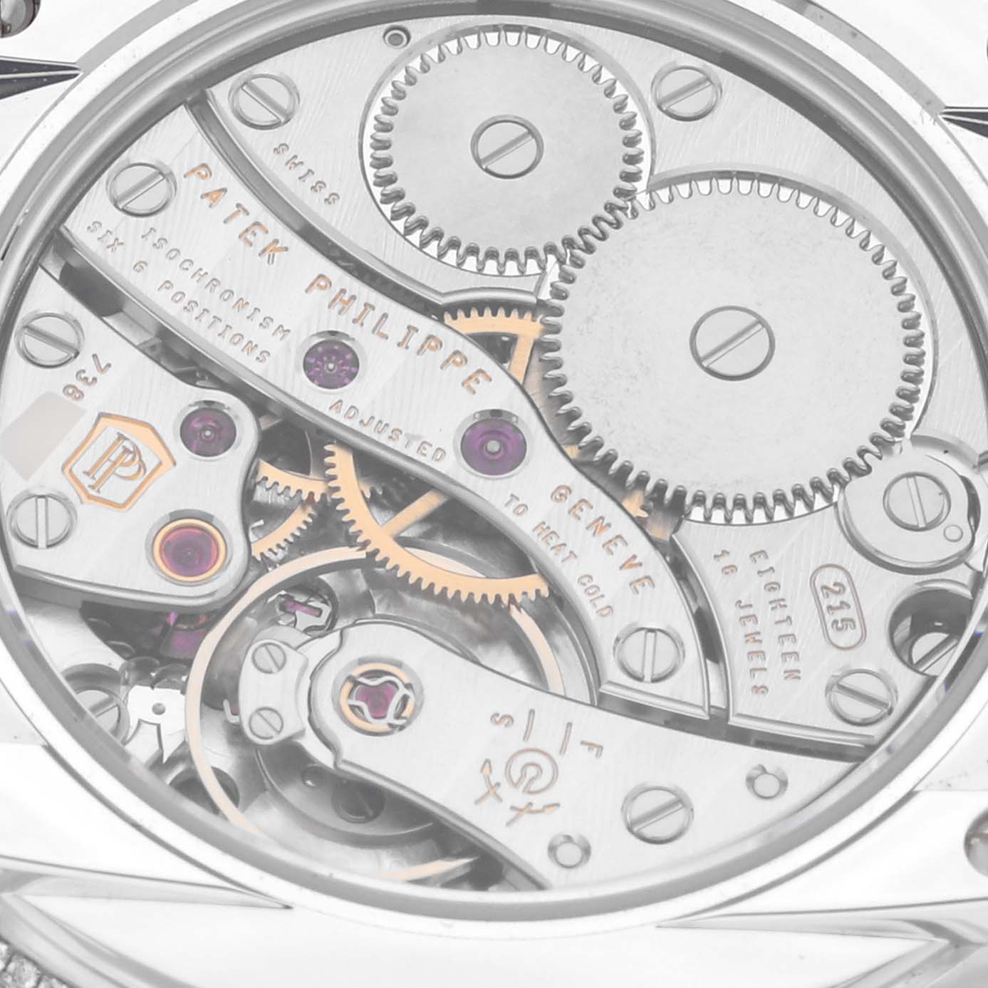 This image shows the intricate movement and mechanical parts of a Patek Philippe Complications 4968G-010 Women's White Gold Mother of Pearl Dial 4968G-010 Women's White Gold Mother of Pearl Dial model watch from a rear angle.