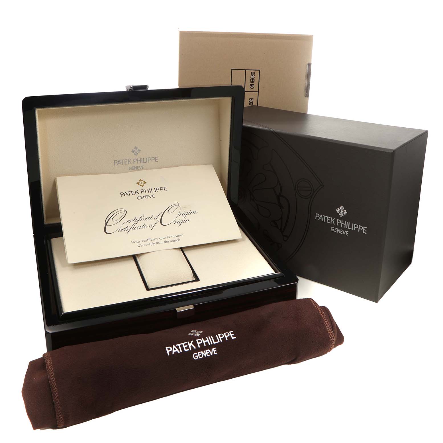 The image shows a Patek Philippe Nautilus 5712G-001 Men's White Gold Grey Dial watch box set with a certificate of origin and branded sleeve.