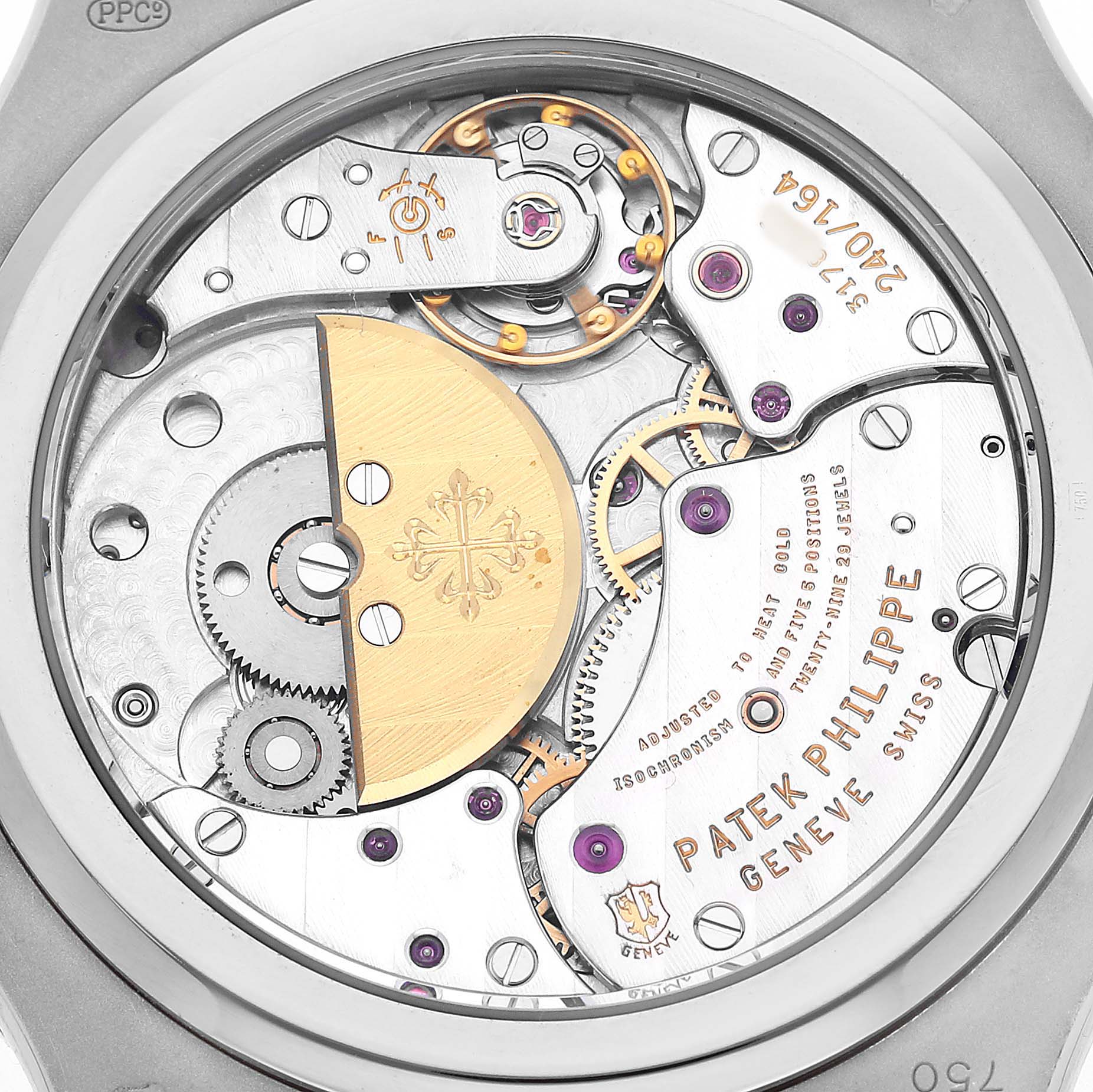 The image shows the movement of a Patek Philippe Nautilus 5712G-001 Men's White Gold Grey Dial watch from the back, highlighting gears and the rotor.