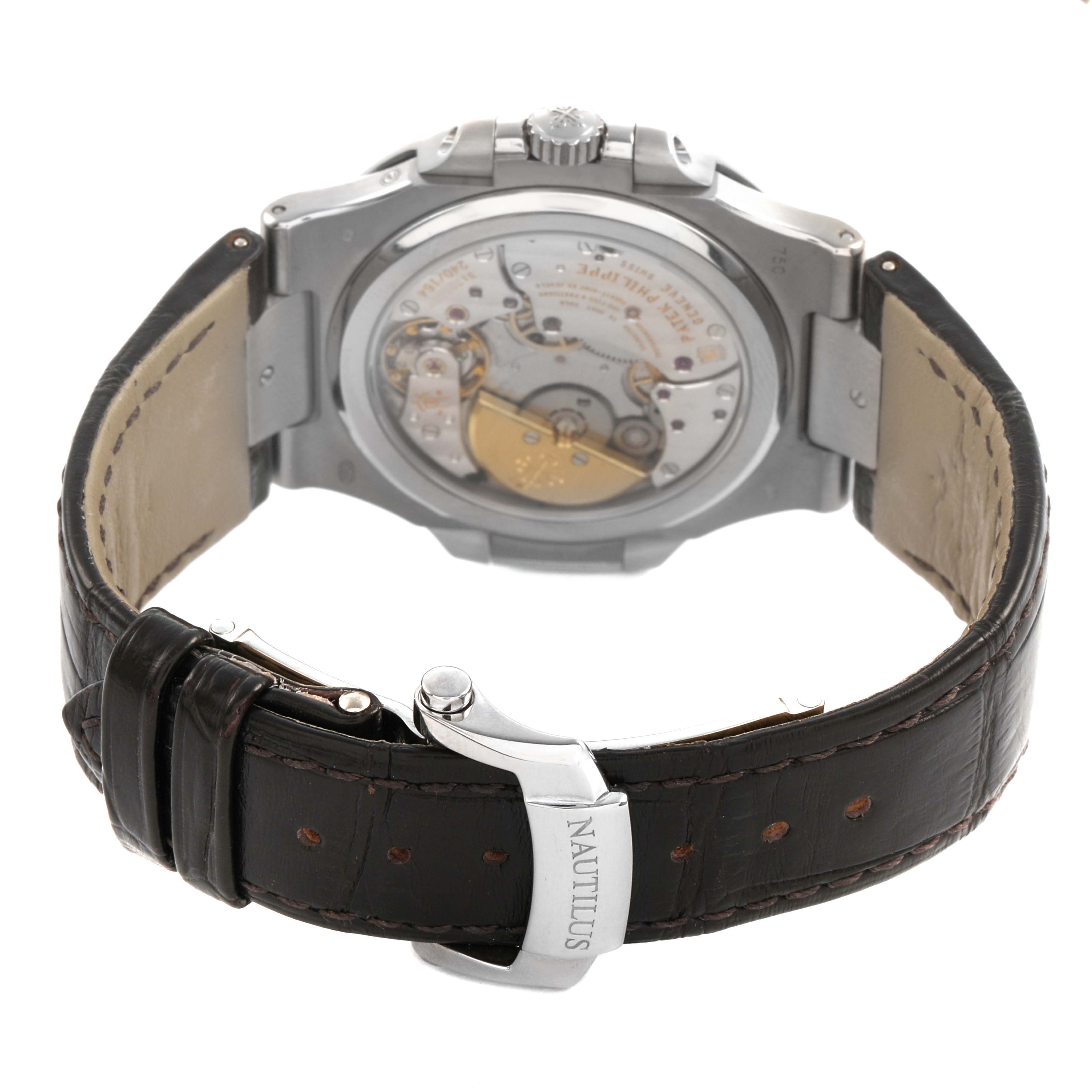 The Patek Philippe Nautilus 5712G-001 Men's White Gold Grey Dial watch is shown from the back, highlighting the movement and leather strap with clasp.