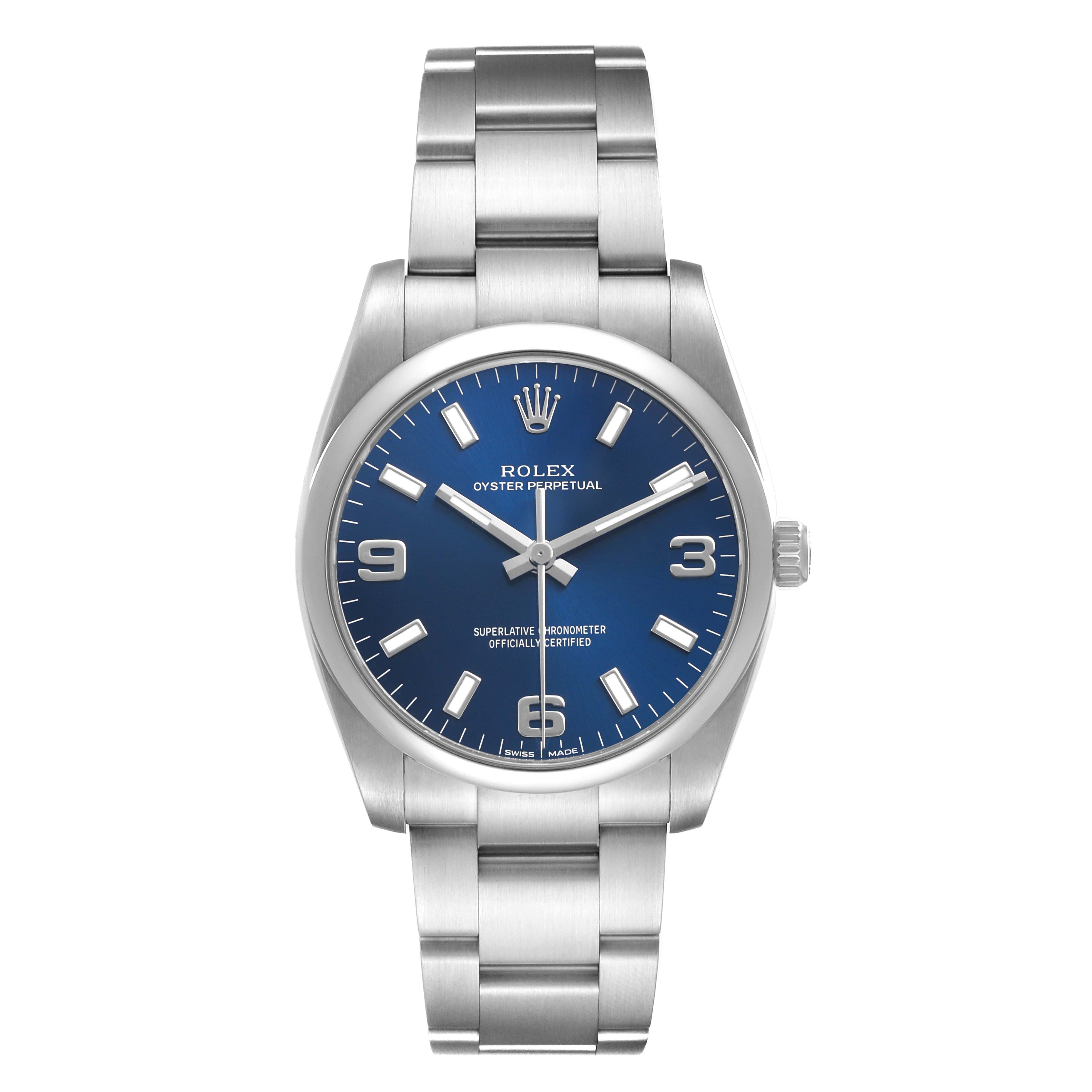 The Rolex Oyster Perpetual 114200 Men's Stainless Steel Blue Dial watch is shown from a front angle, displaying the blue dial and stainless steel bracelet.